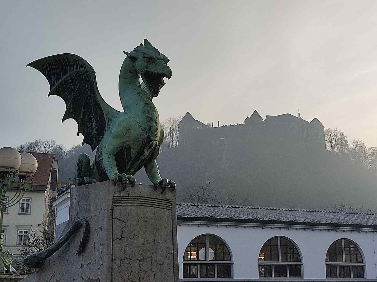 Designed as a symbol of Ljubljana's modernization, the Dragon Bridge was a radical choice for its time, employing reinforced concrete because it was significantly cheaper than traditional stone, stretching the city's reconstruction budget.
