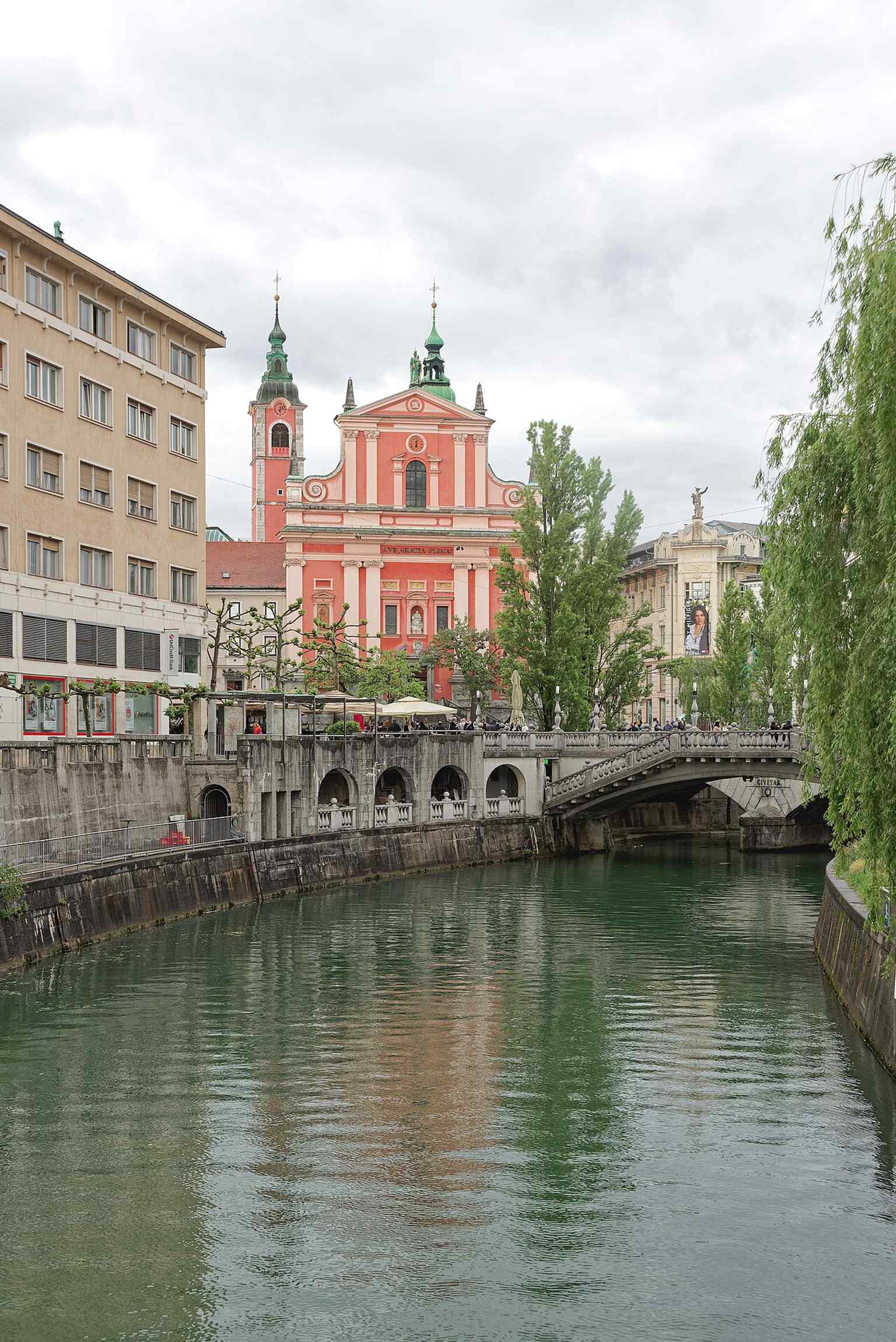 The Franciscan Church stands prominently by the Ljubljanica River, a central location chosen by the Franciscans after relocating from their original 13th-century monastery.