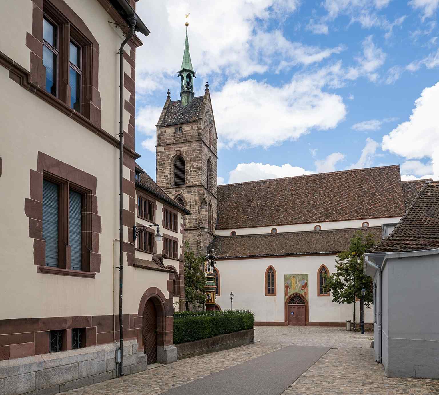 The Martinskirche rising above Basel’s old town, beside the State Archives — a landmark that overlooks Grossbasel from the Münster hill.