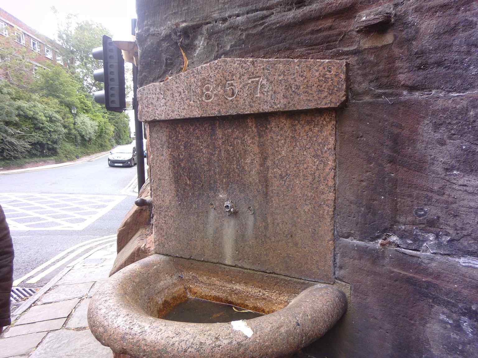 Another view of the fountain, showing the stonework detail on the gate’s edge and the Victorian date associated with it.