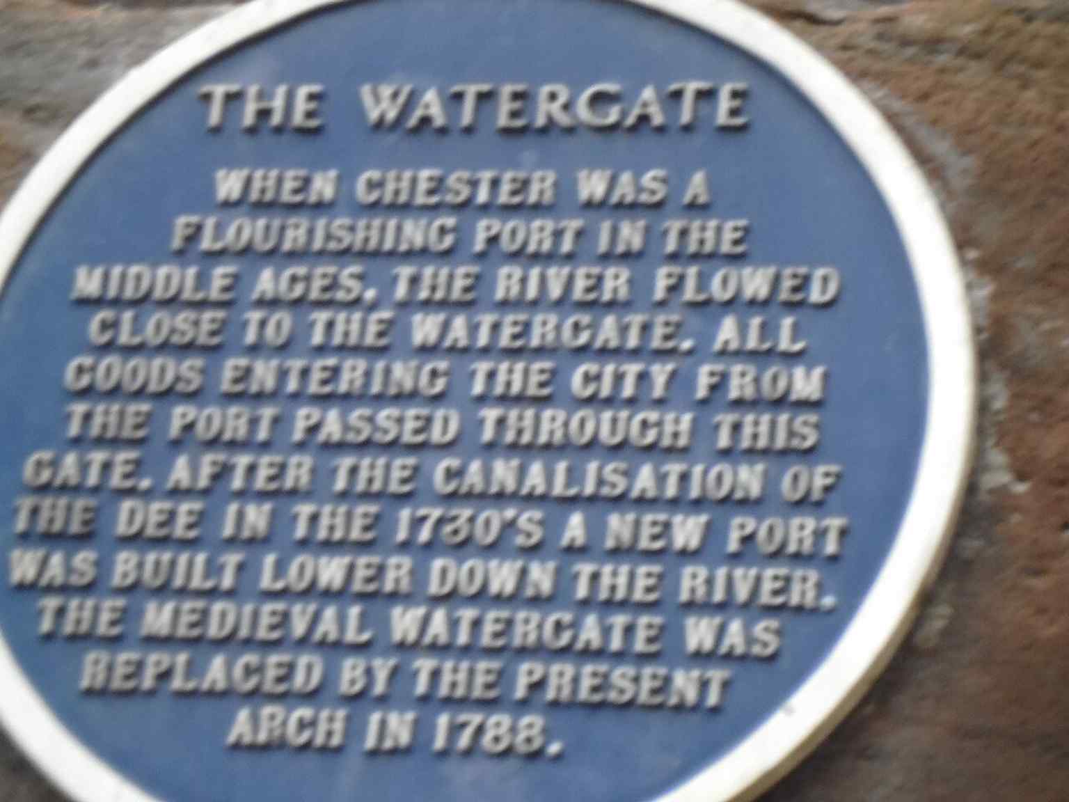 A closer look at the blue plaque from below, adding context to this Grade I listed gateway on the city walls.