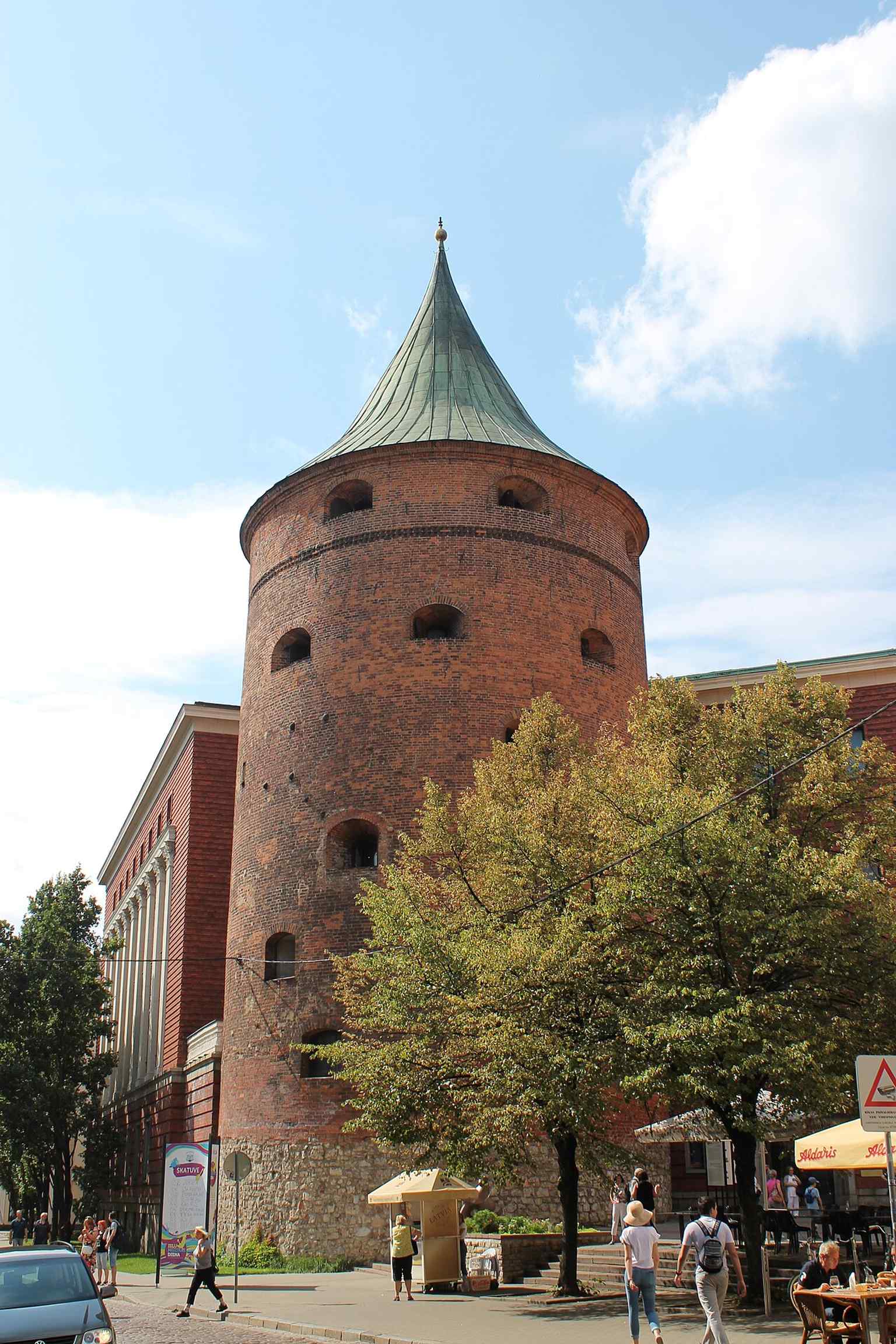 A clear street-level view of the Powder Tower in modern Riga, the last surviving tower of the city fortifications.