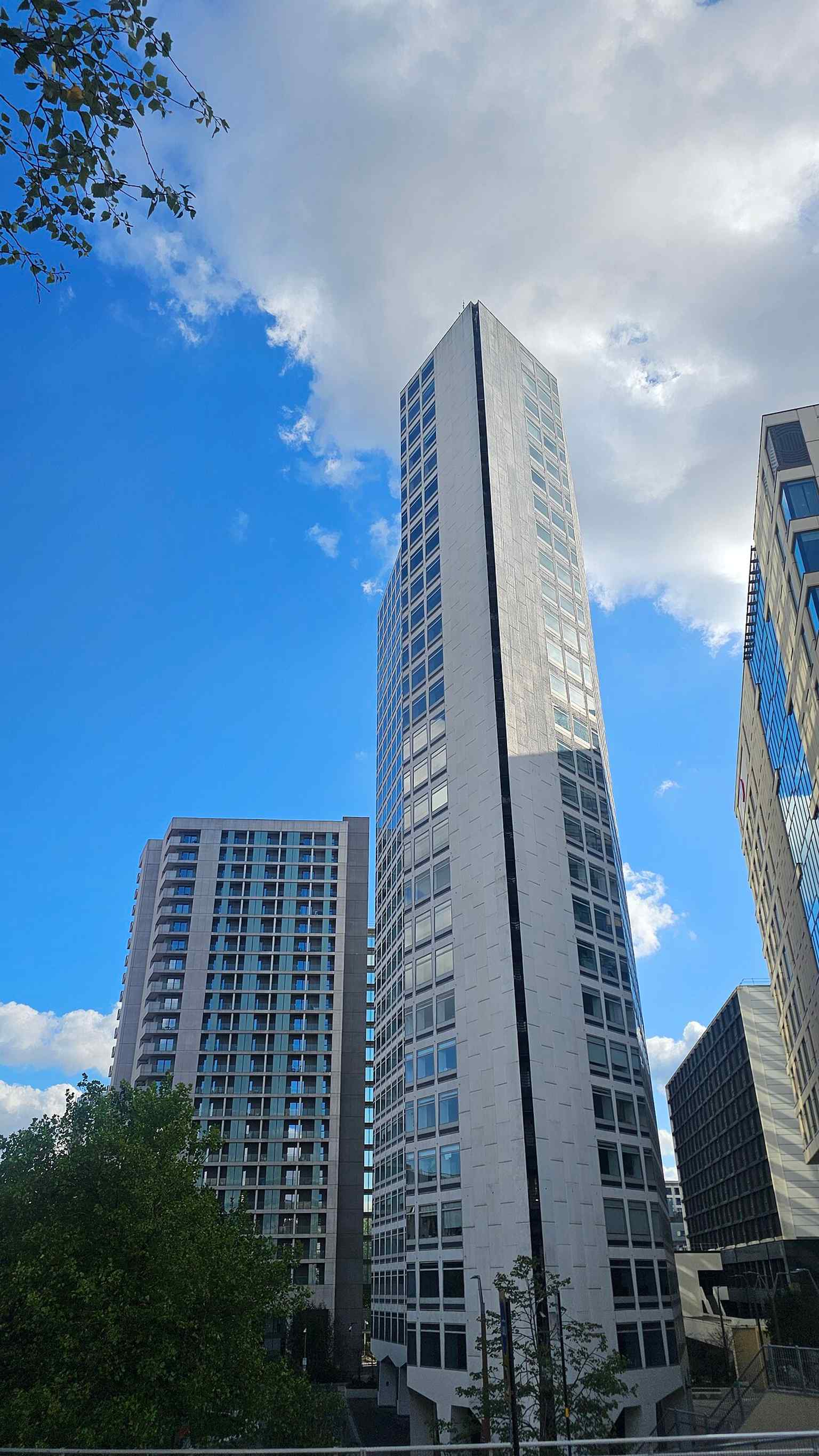 A clear modern view of Alpha Tower, the 100-metre Grade II listed office tower that survived the wider ATV Centre redevelopment.