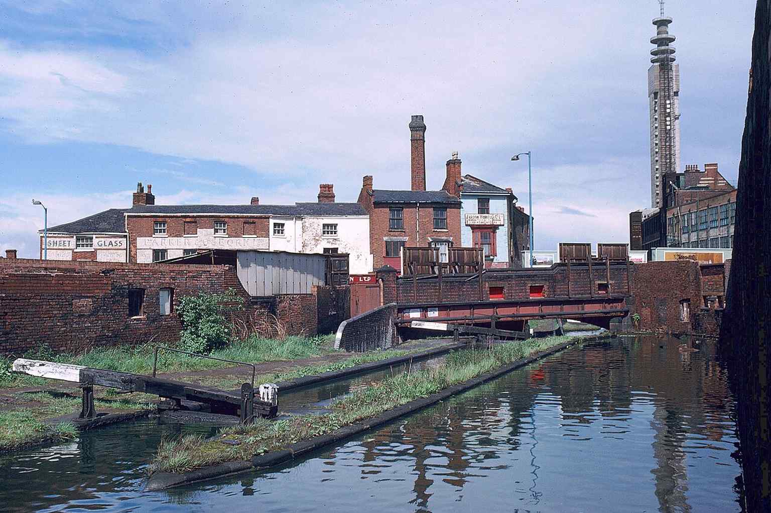 The BT Tower in 1966, freshly completed and still awaiting its communications equipment — a rare view from the canal just before it became operational.