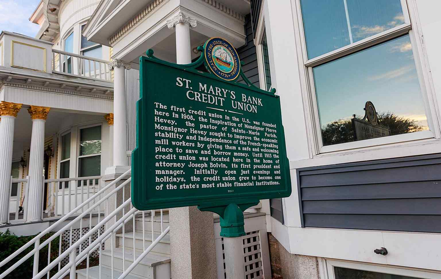 A historic plaque marking America's Credit Union Museum and its National Register-listed origin as the old St. Mary’s credit union site.