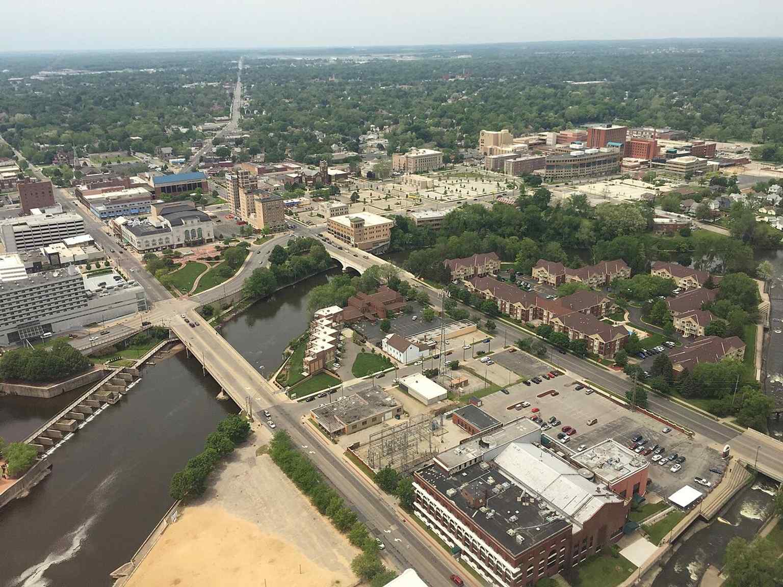 An aerial view of downtown South Bend with the Morris visible among the skyline, highlighting its place beside the neighboring Palais Royale and other downtown landmarks.