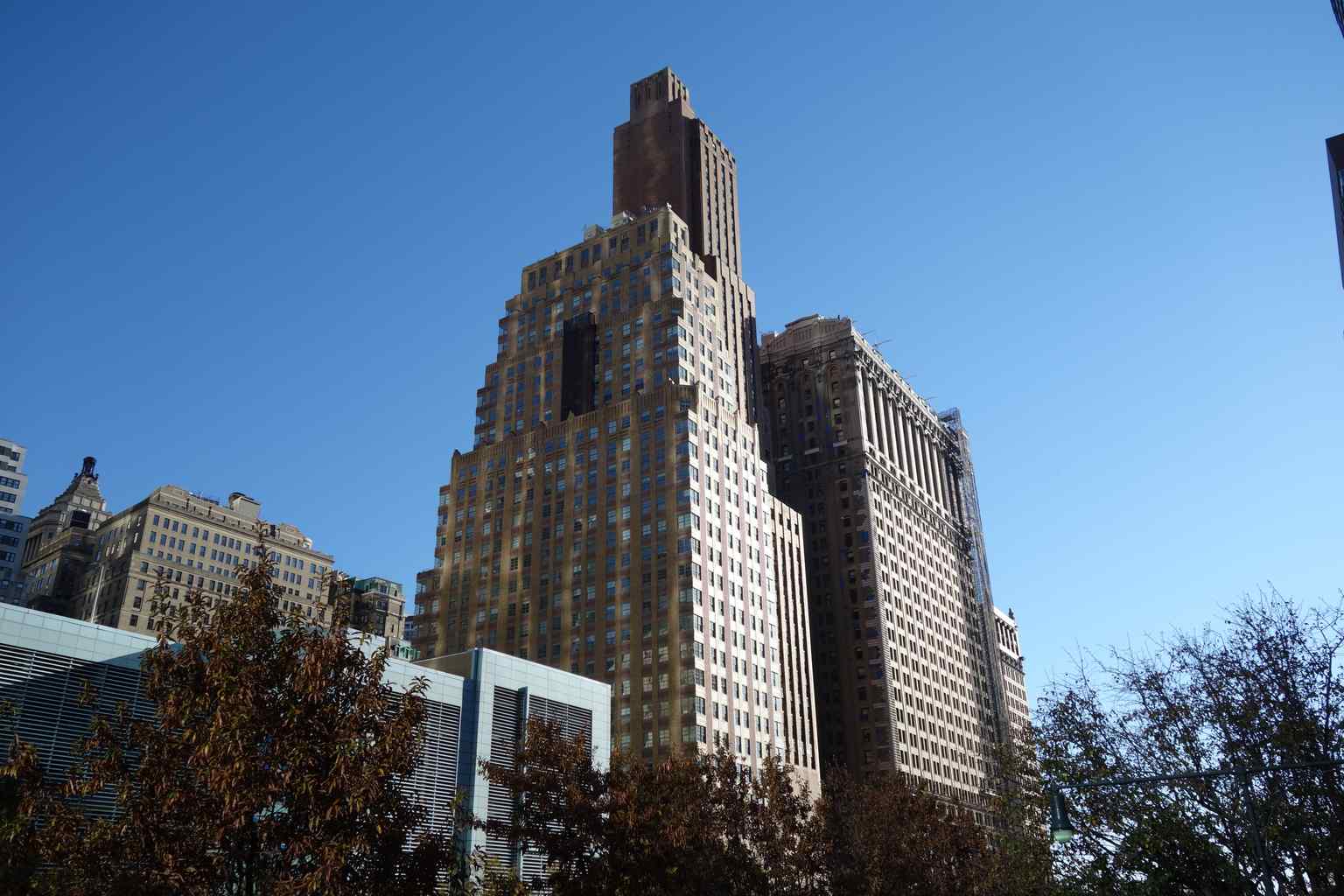 The Downtown Athletic Club building at 20 West Street, designed in the Art Deco style by Starrett & van Vleck, stands next to its simultaneously designed neighbor, 21 West Street.