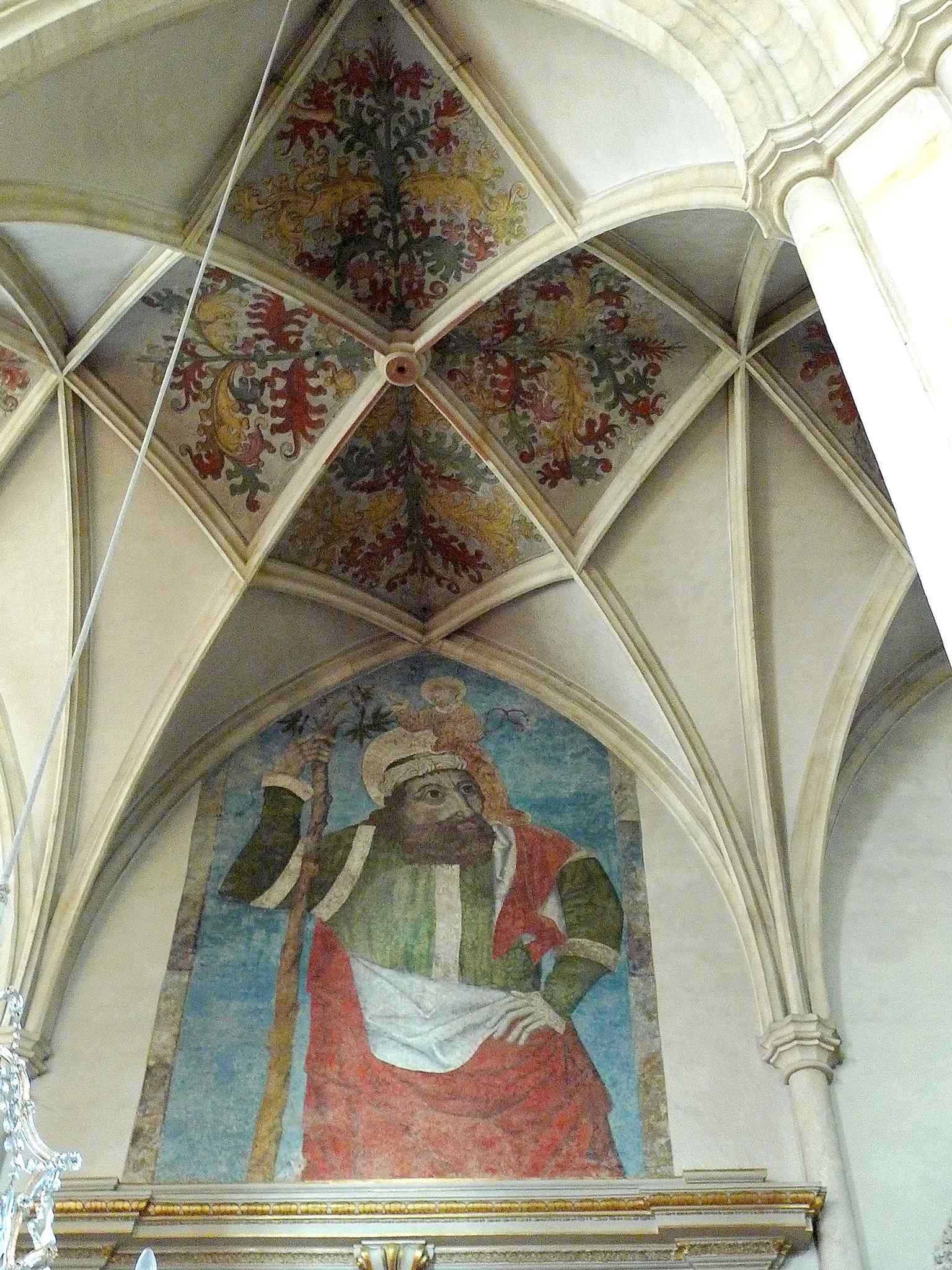 Saint Christopher fresco on the cathedral exterior, one of the few surviving traces of the building’s former painted façades.