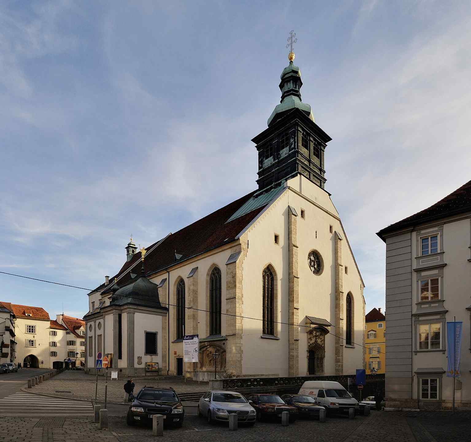 The cathedral’s broad, sober exterior in full view — a good introduction to the late Gothic church from 15th-century Graz.