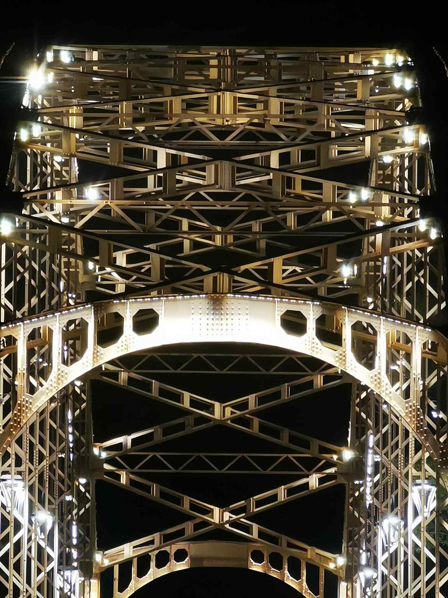 Another illuminated night view, ideal for the tour segment about the bridge as a visible city landmark after dark.