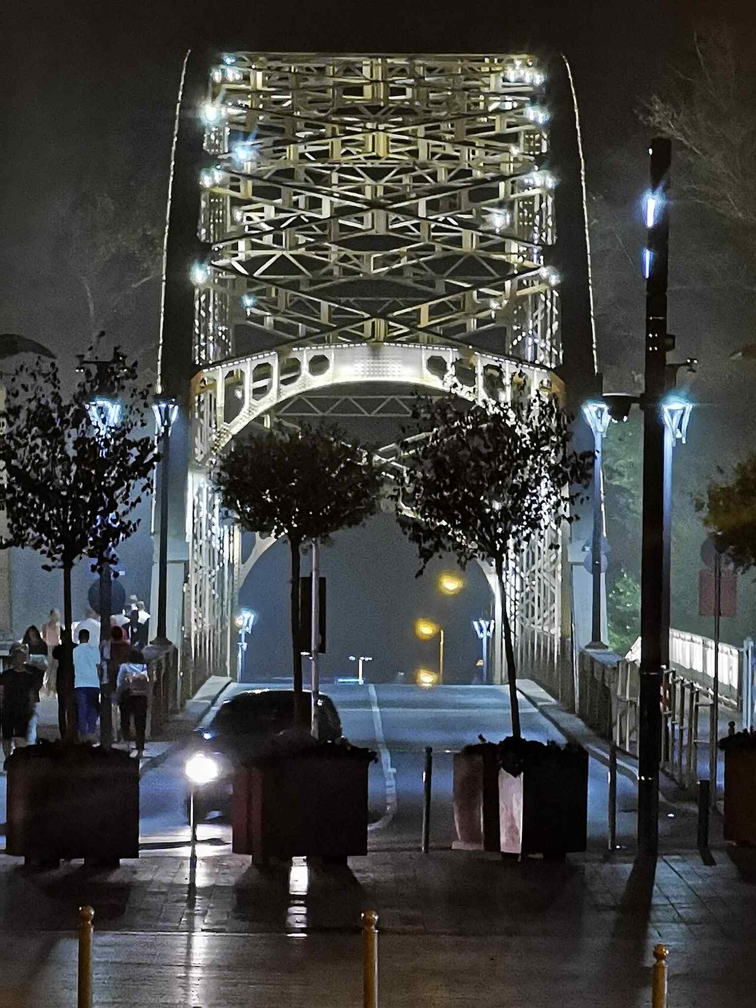 A final night-time angle showing how the bridge’s lighting makes it stand out as a landmark on the river.