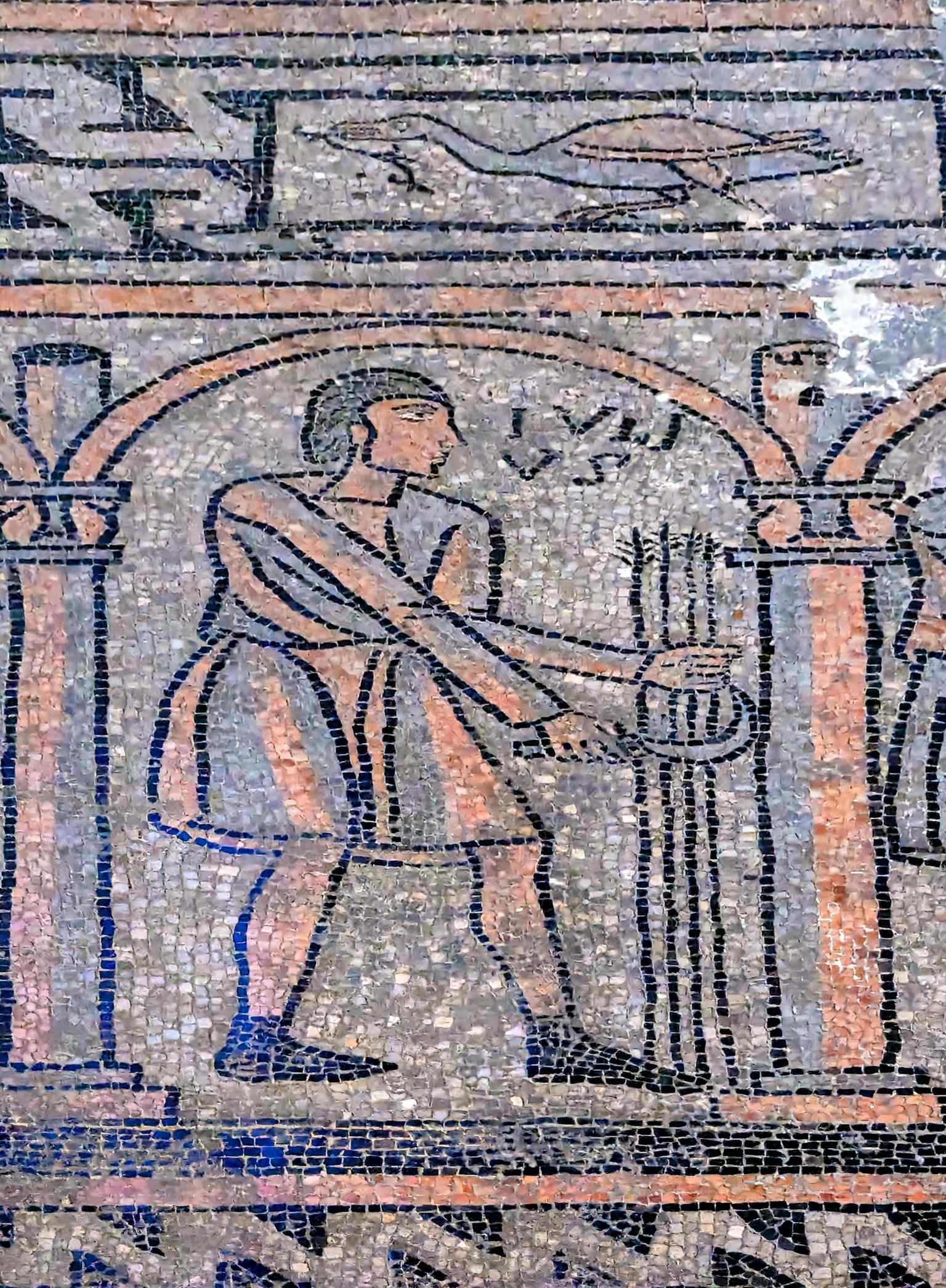A surviving fragment of the 12th-century floor mosaic in the apse, depicting the cycle of months and the 'Re-Anno' (King-Year), which once played a symbolic role in royal coronations.