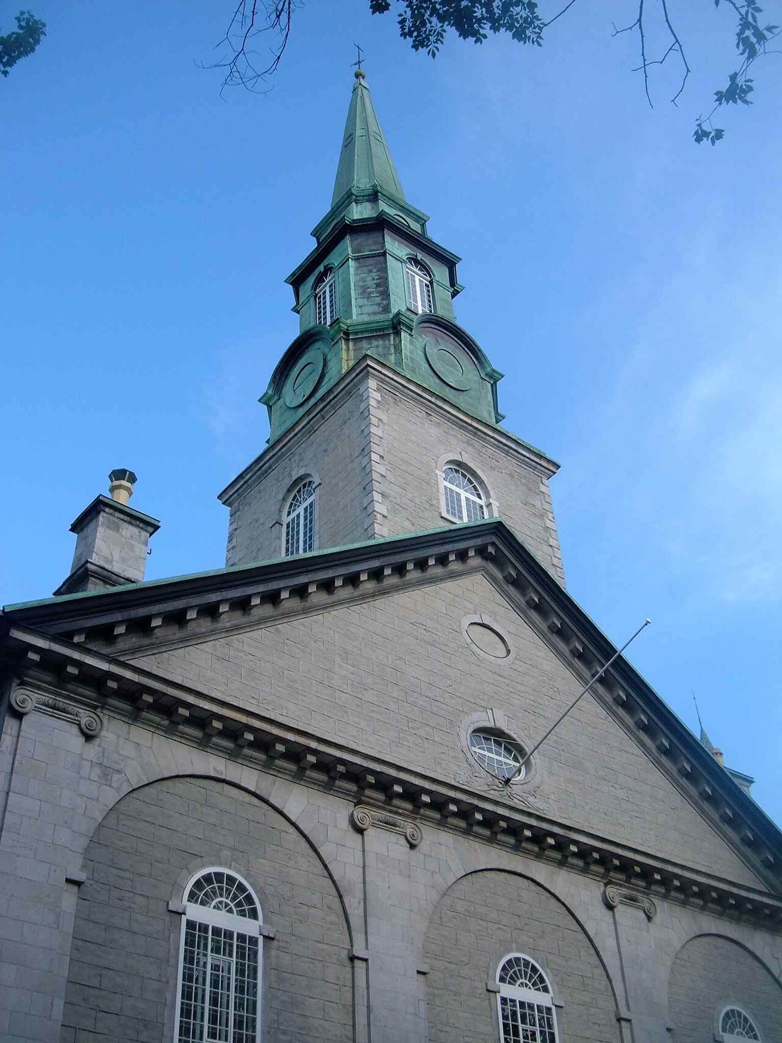 A classic street-level view of the stone cathedral, useful for showing how the building sits in the tight fabric of Old Quebec.