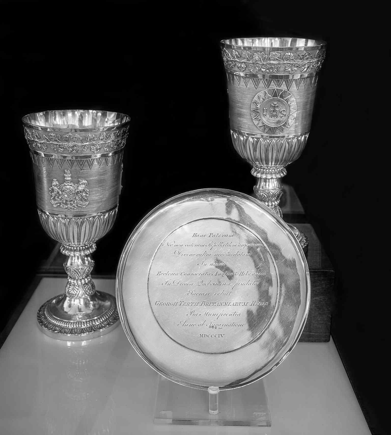 The communion vessels connect the cathedral to royal patronage: George III supplied liturgical objects for worship here.