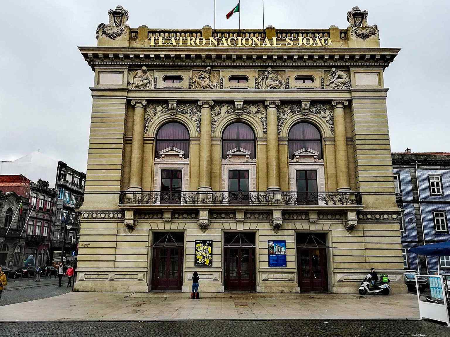 Facade detail of the São João National Theatre, where the decorative reliefs symbolize human passions like Kindness and Love.