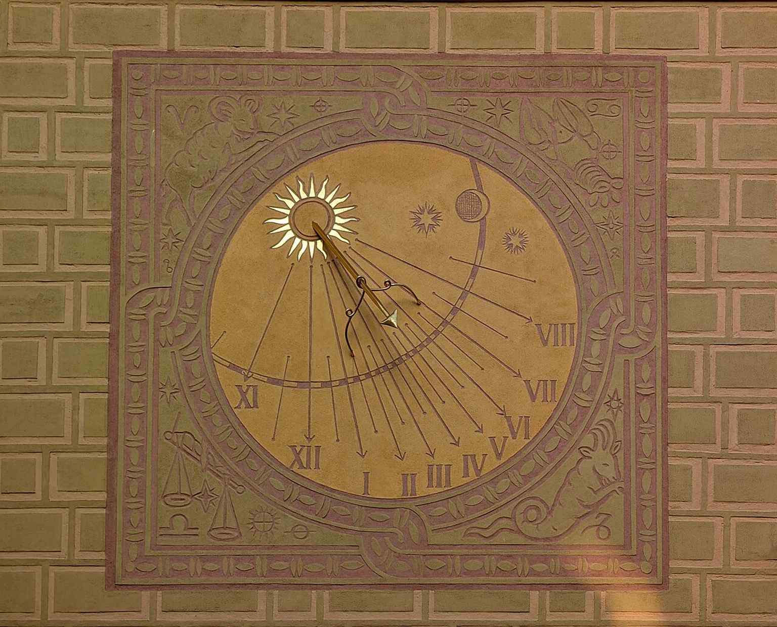 The ornate vertical sundial on the House under the Lion, a decorative detail on the square that fits the postwar revival of historic façades.