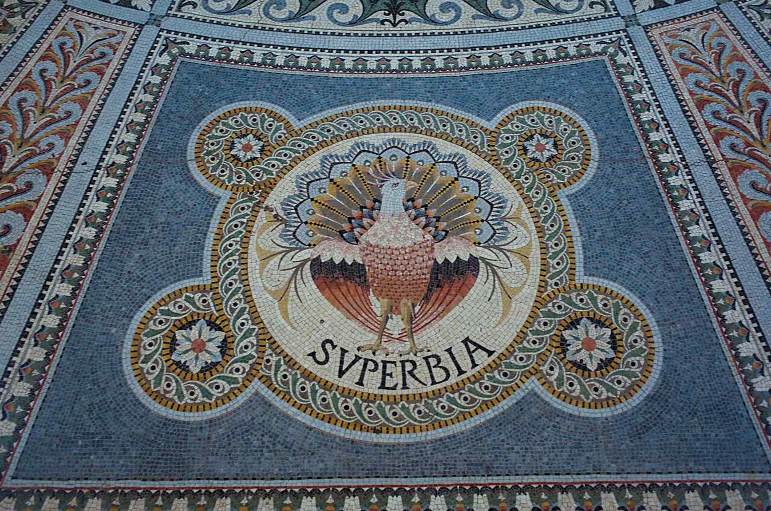 This allegorical medallion from the lower church shows the basilica’s dense moral iconography, where even vice and virtue are worked into the decoration.