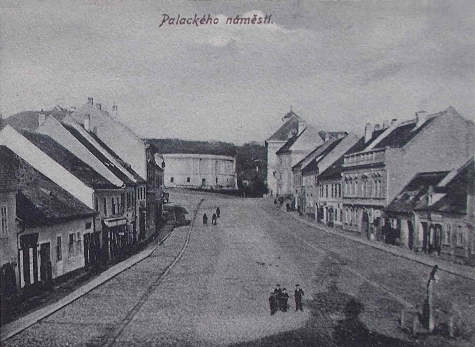 This historic view from inside the Hodinová brána (Clock Gate), dating from before 1905, looks north into Palackého náměstí, showing the square just before the gate's demolition.