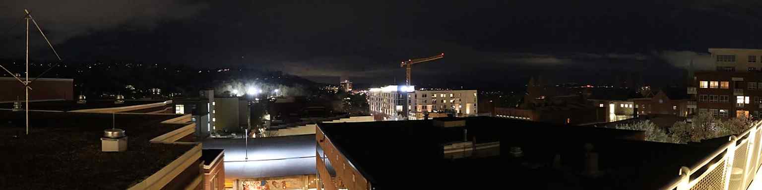 A wide panorama that places the museum in downtown Asheville, near the civic and cultural heart of Pack Square.