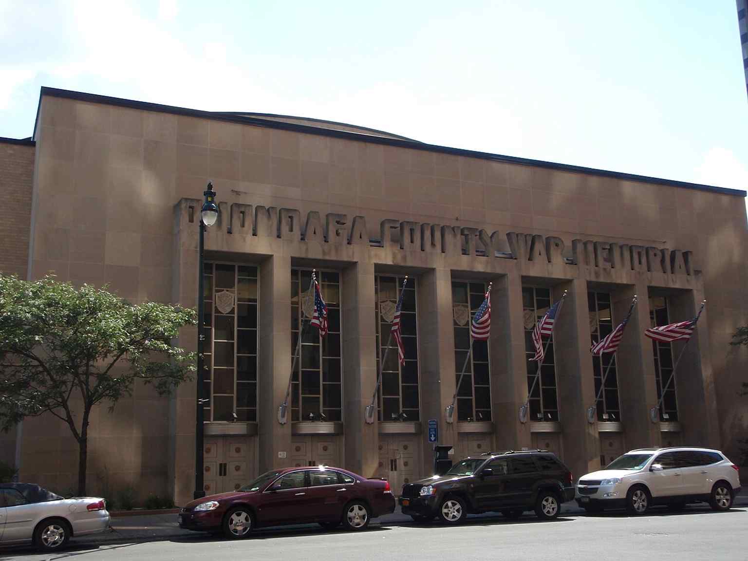 The arena in a clear modern exterior view, useful for showing how the old War Memorial still anchors the Oncenter complex today.