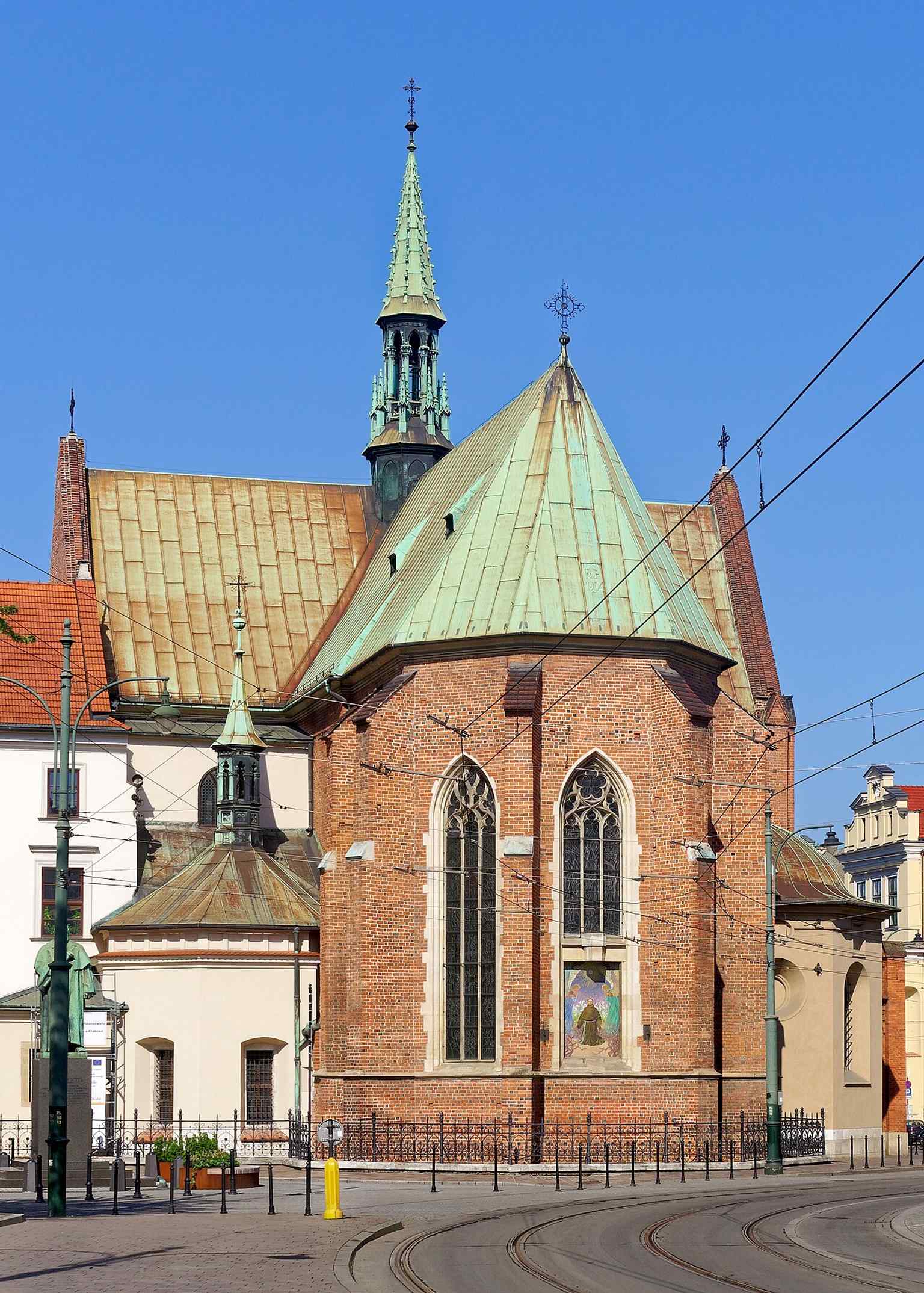 A modern exterior photograph from 2020, showing the basilica’s facade and its urban setting near the Old Town.