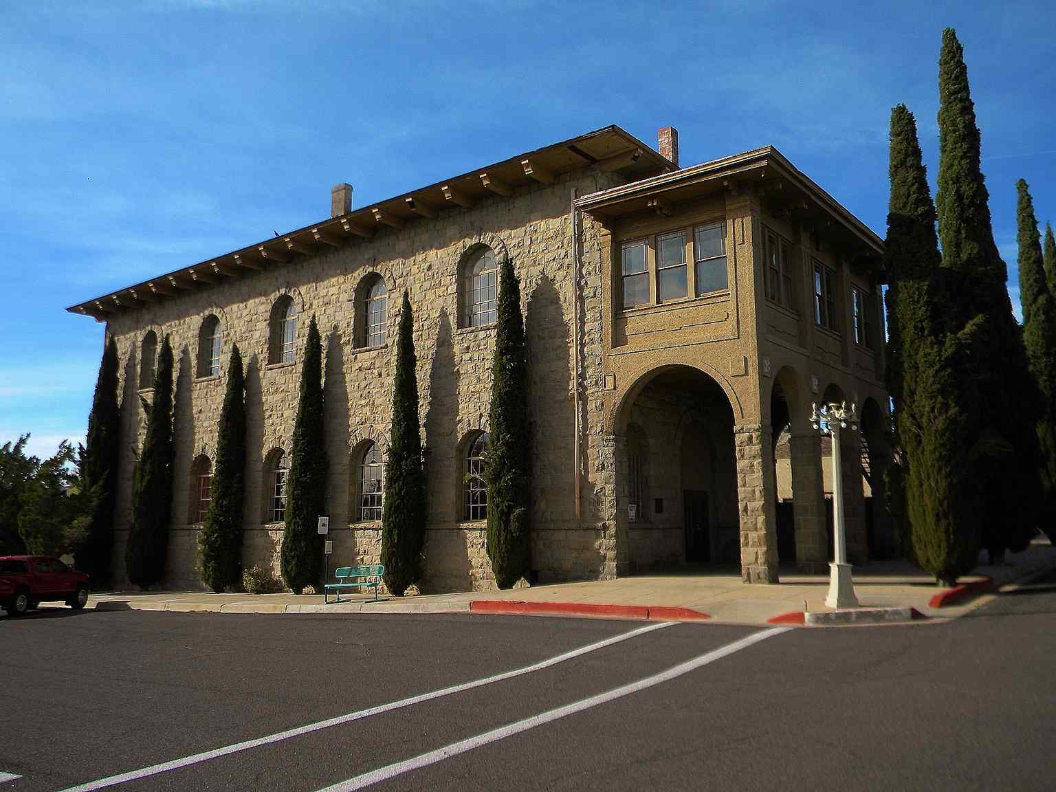 A view of the historic Elks Lodge building, showcasing its imposing Romanesque architecture and thick heavy walls. (2016)