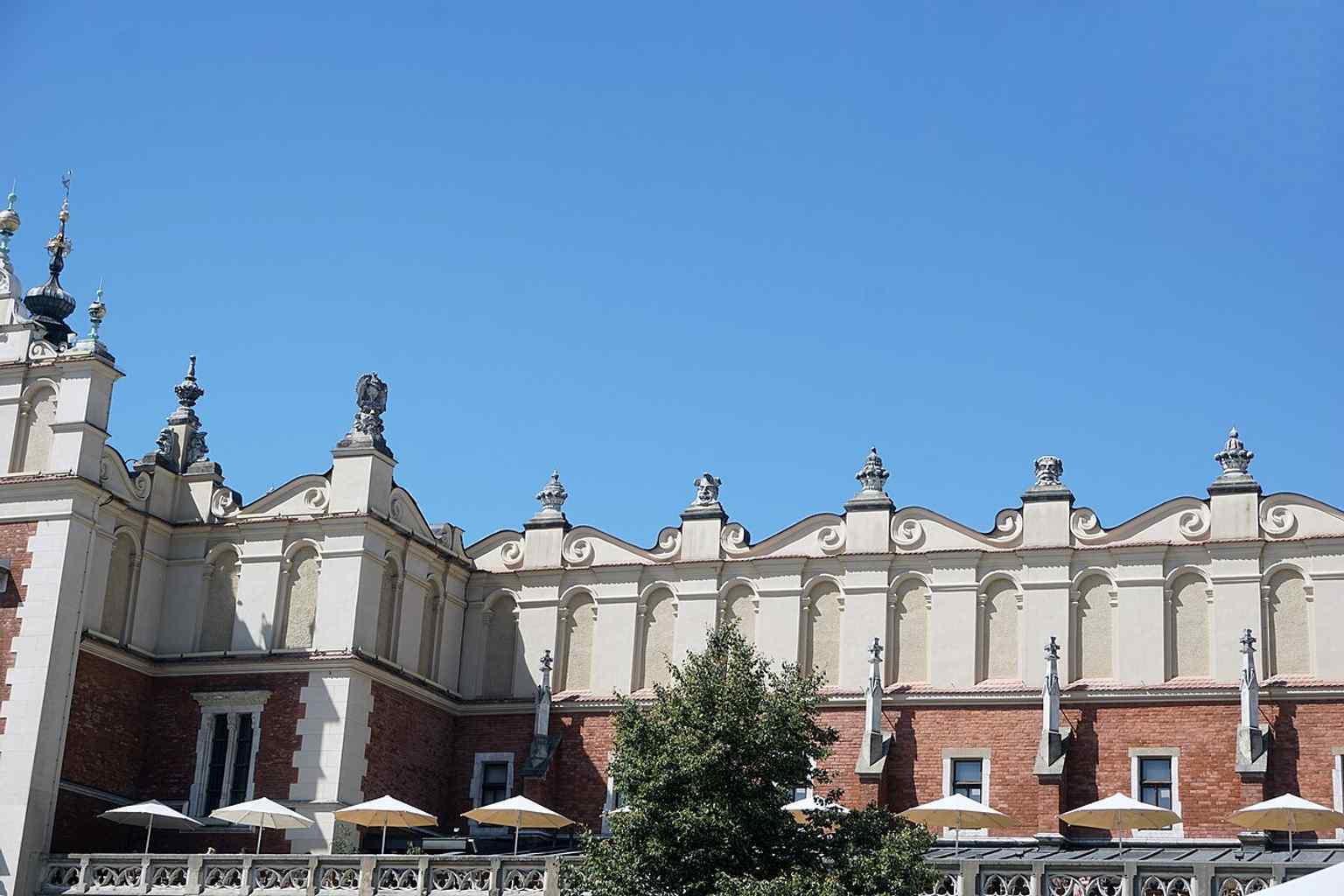 A sharp modern exterior shot of the Cloth Hall, suited to highlighting details of the arcade and upper façade in current daylight conditions.