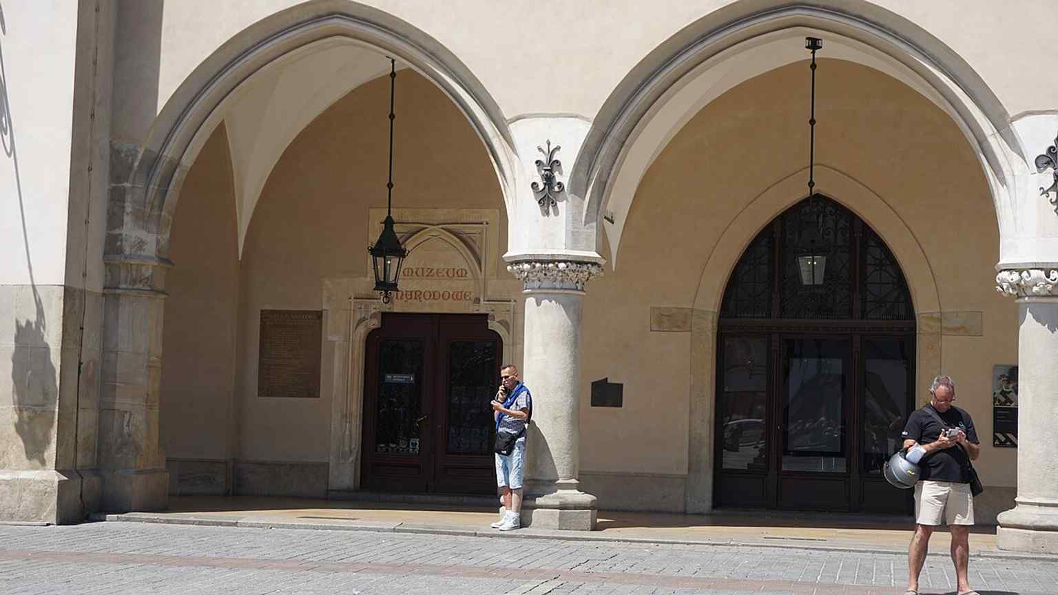 A broad contemporary view of Sukiennice, ideal for showing the renovated Renaissance frontage and the building’s central position on the square.