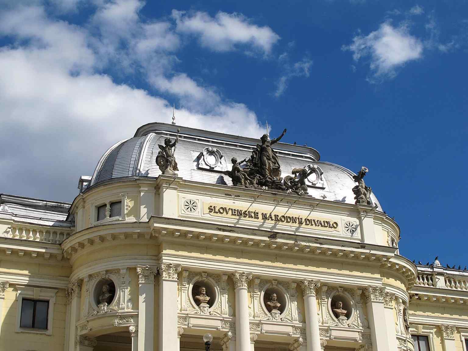 A clear view of the neo-Renaissance theatre façade in Bratislava, linking the building’s elegant exterior to its long role as the original seat of Slovak National Theatre.