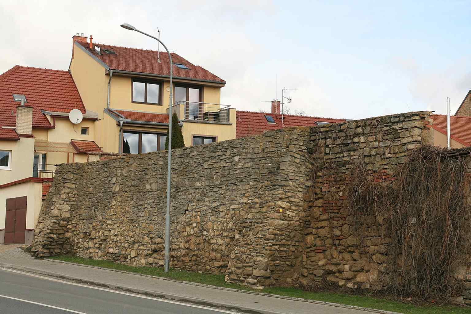 Two distinctive supporting pillars are visible on this section of the city walls in Kollárova street, a feature noted in the 1965 documentation of this cultural monument.