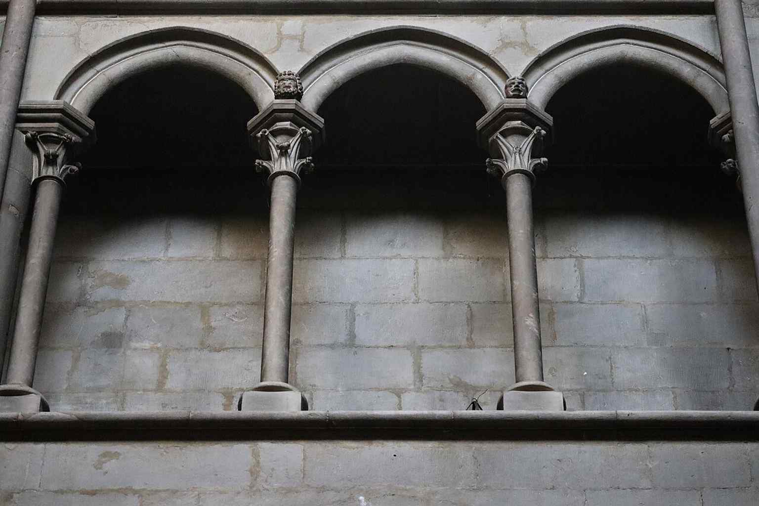 A view into the choir or transept, revealing the subtle play of "vides et pleins" (openings and solid parts) that gives the interior its monumental feel.