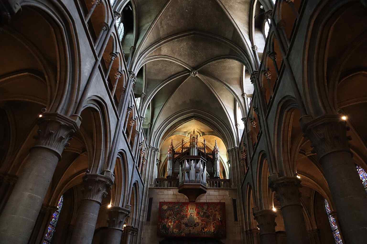 The grand Neo-Gothic organ, with its mechanical and sound elements crafted by Jean-Baptiste Ghys in 1893, resting on the tribune where Jean-Philippe Rameau once played.