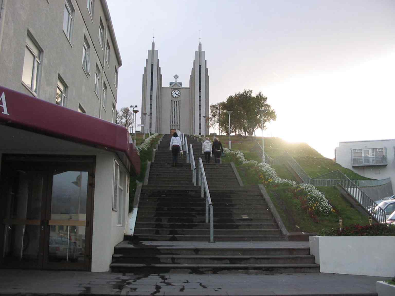 Downtown Akureyri with Akureyrarkirkja visible above the city, showing how centrally the church anchors the townscape.