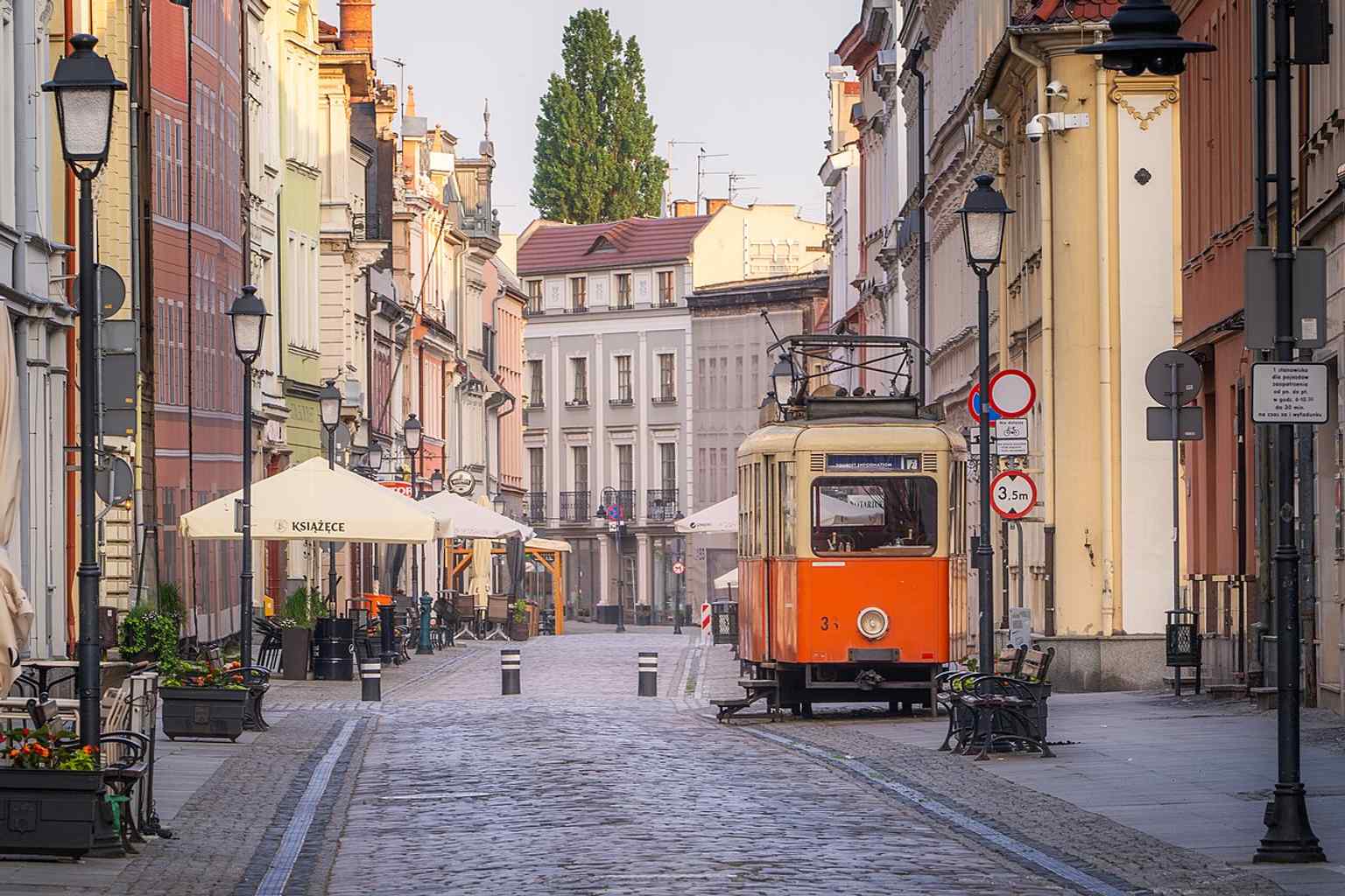 The preserved vintage tram on Długa Street — a nod to the street’s long tramway history, including the 1896 electrification era and today’s tourist information point.