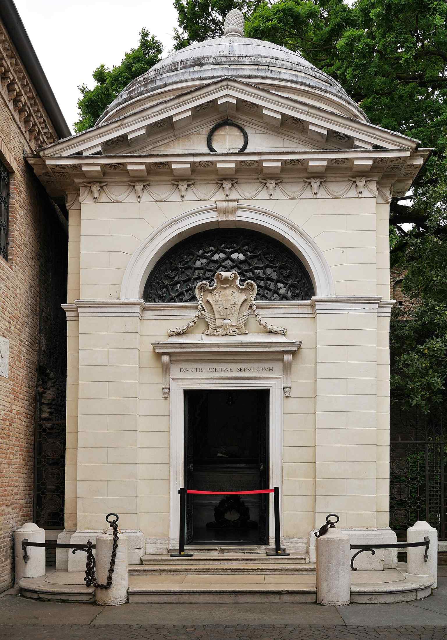 A broader exterior view that shows the tomb in its urban setting, helping explain why the site became a protected “zone of silence.”