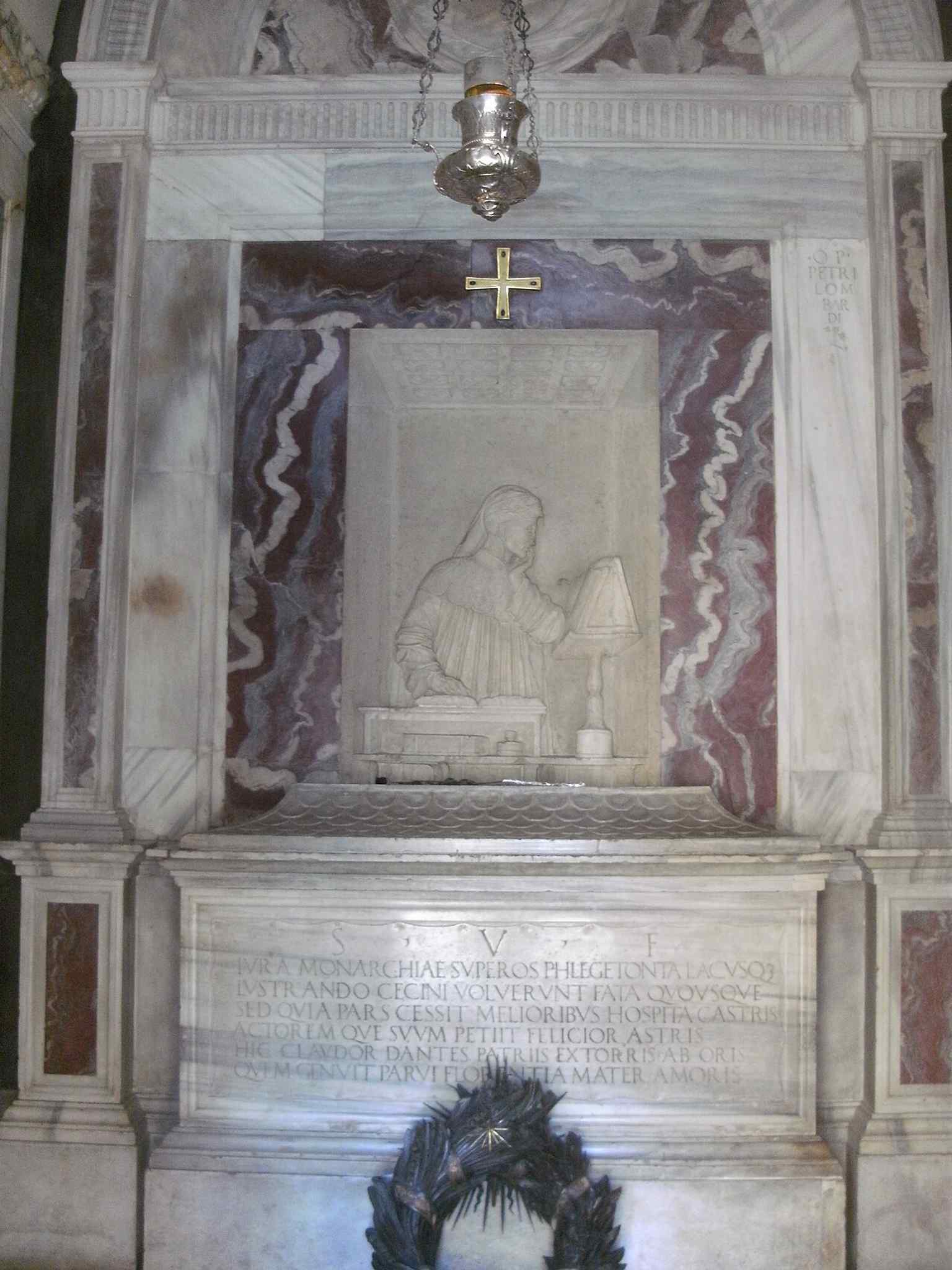 The sarcophagus with Latin epitaph, linking the modern mausoleum to the older burial traditions of Ravenna.