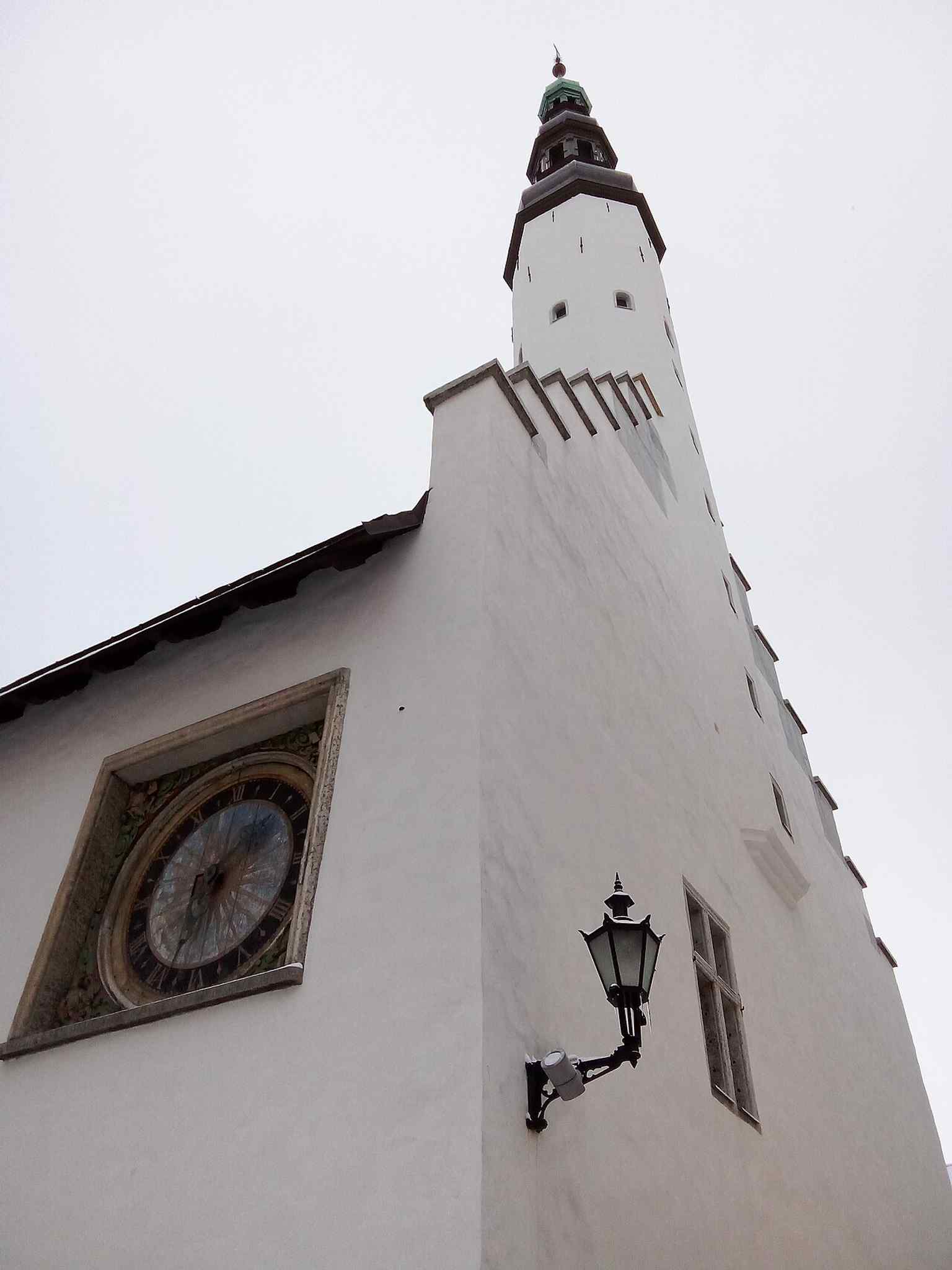 A crisp modern view of the Church of the Holy Spirit’s compact medieval body and tall western tower, the oldest surviving sacred building in Tallinn in its original form.