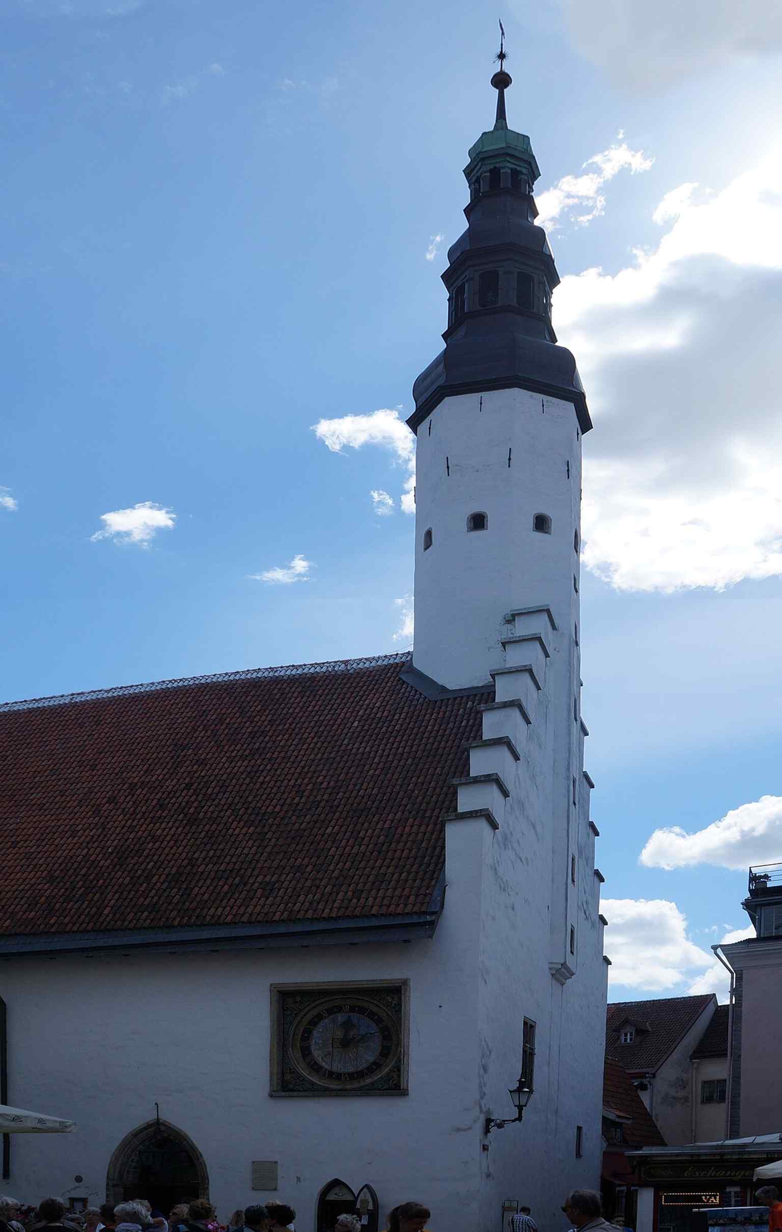 A tall, detailed exterior shot that emphasizes the church’s narrow profile and tower, part of the oldest surviving sacral building in Tallinn.