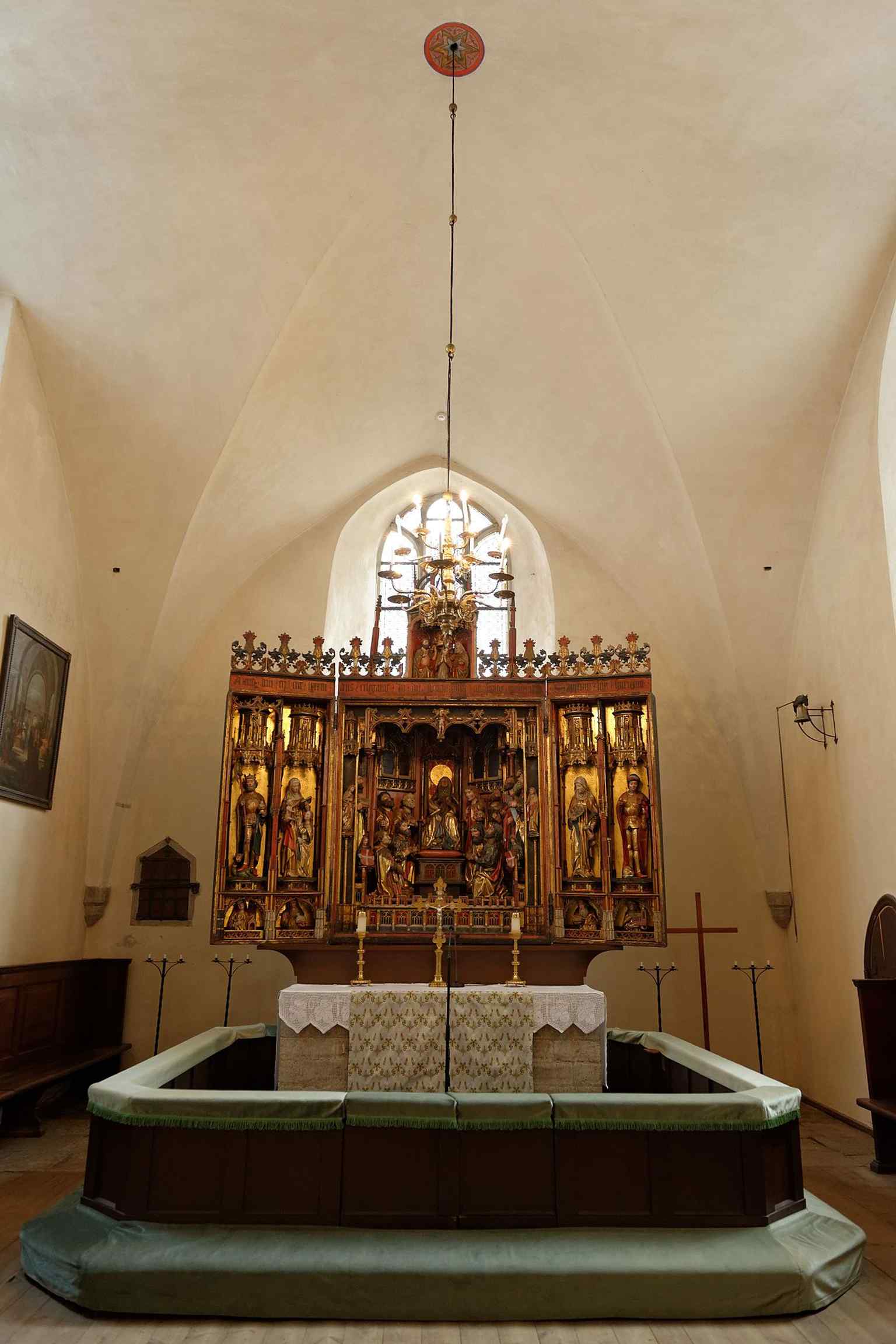 The main altar inside the church, connecting the interior to the long liturgical history that includes major early Estonian-language sermons.
