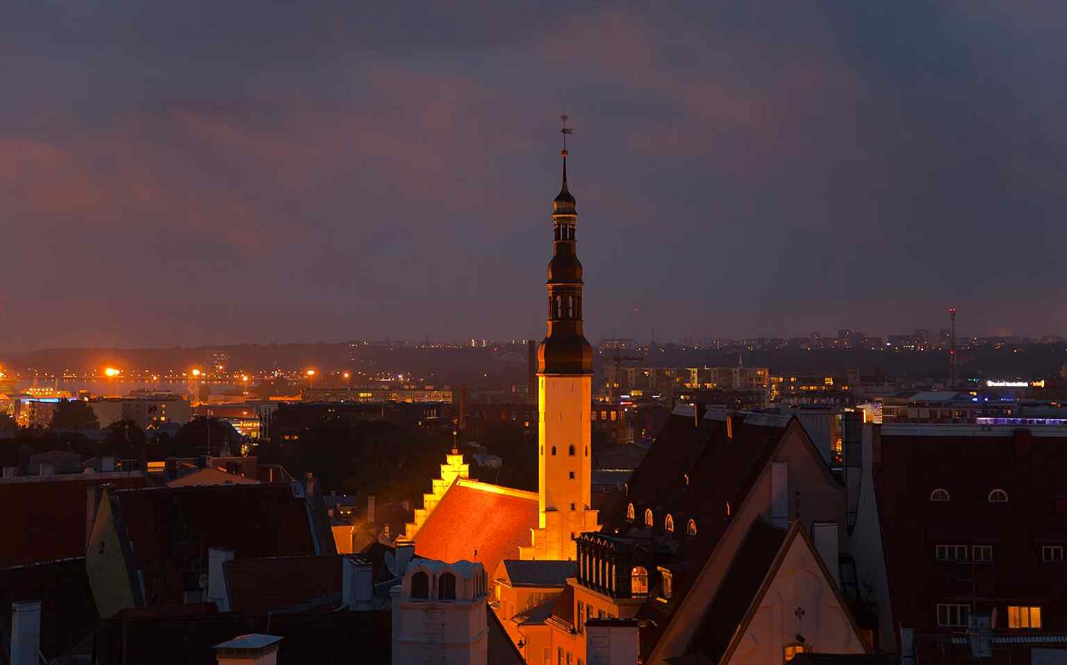 A panoramic view from Toompea placing the church within Tallinn’s medieval skyline, where its small tower still stands out above the Old Town.