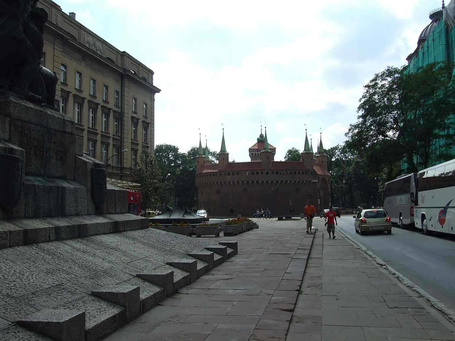 The Barbican beside Matejko Square places the fortress in its urban setting at the edge of Kraków’s Old Town and Planty park.