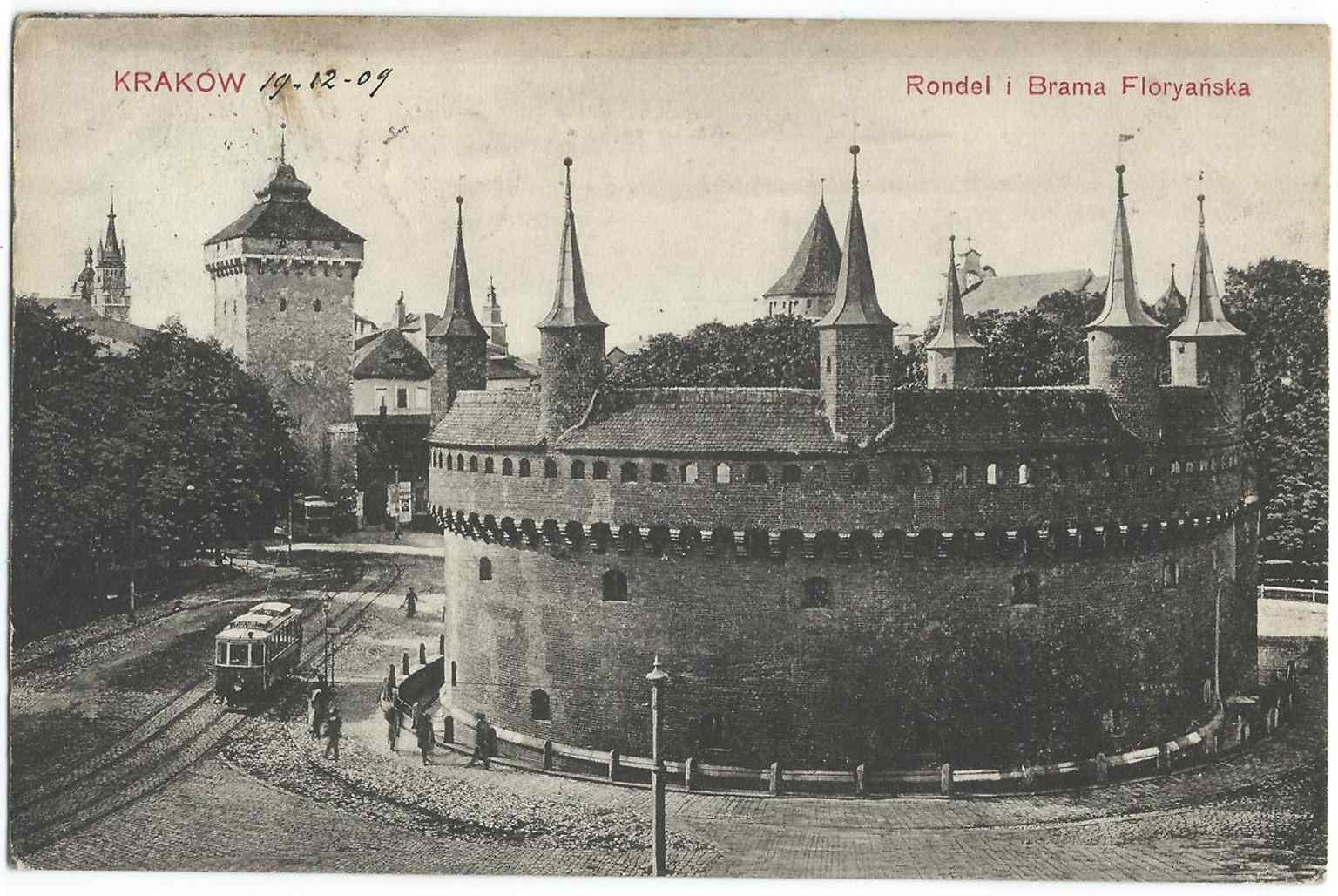 An early 20th-century postcard view of the Barbican and Florian Gate area, echoing the period when the monument was debated as a historic landmark to protect.
