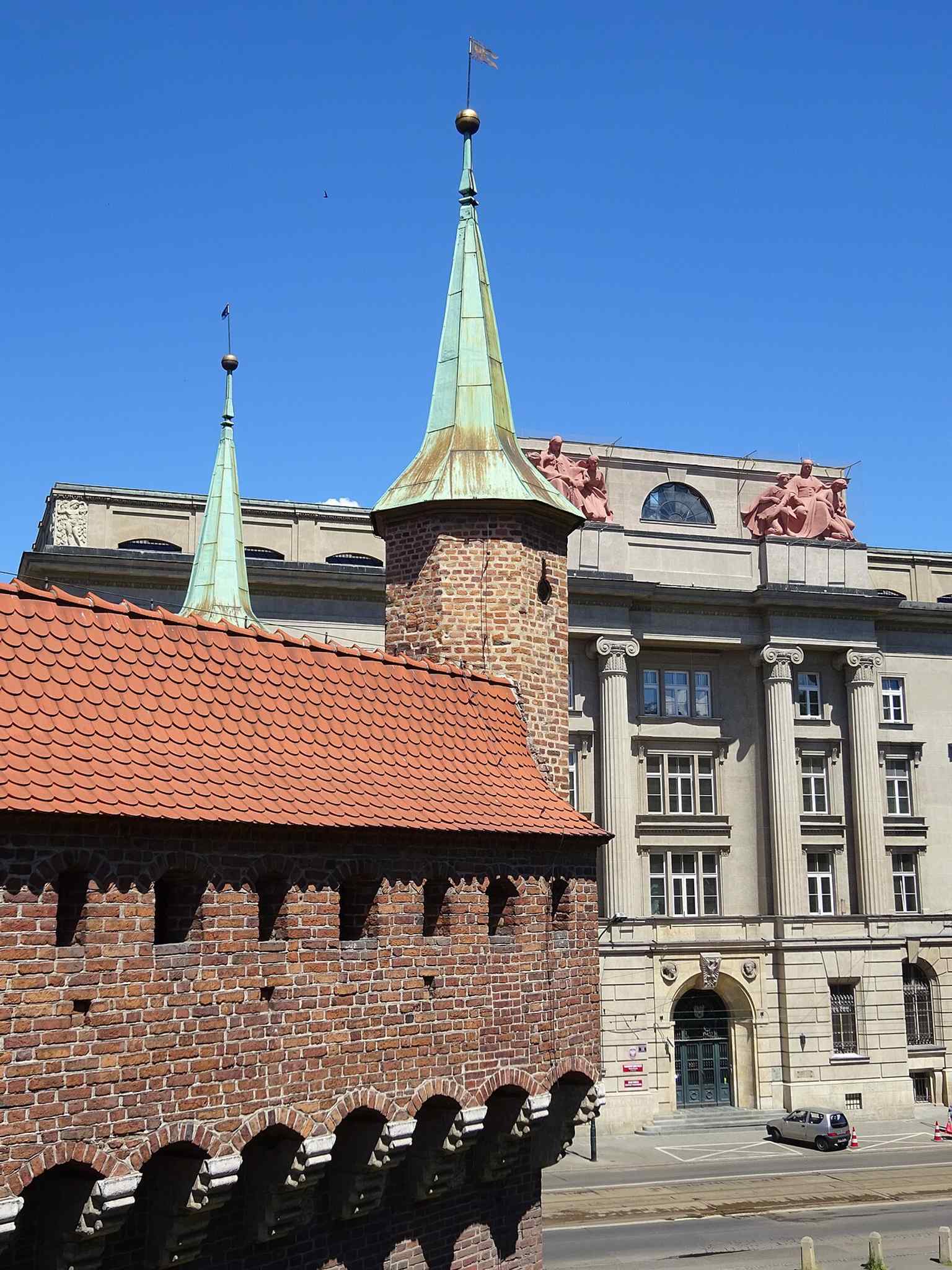 The alternating turret and crenellation detail shows the Barbican’s seven-tower rhythm, one of its most distinctive Gothic features.