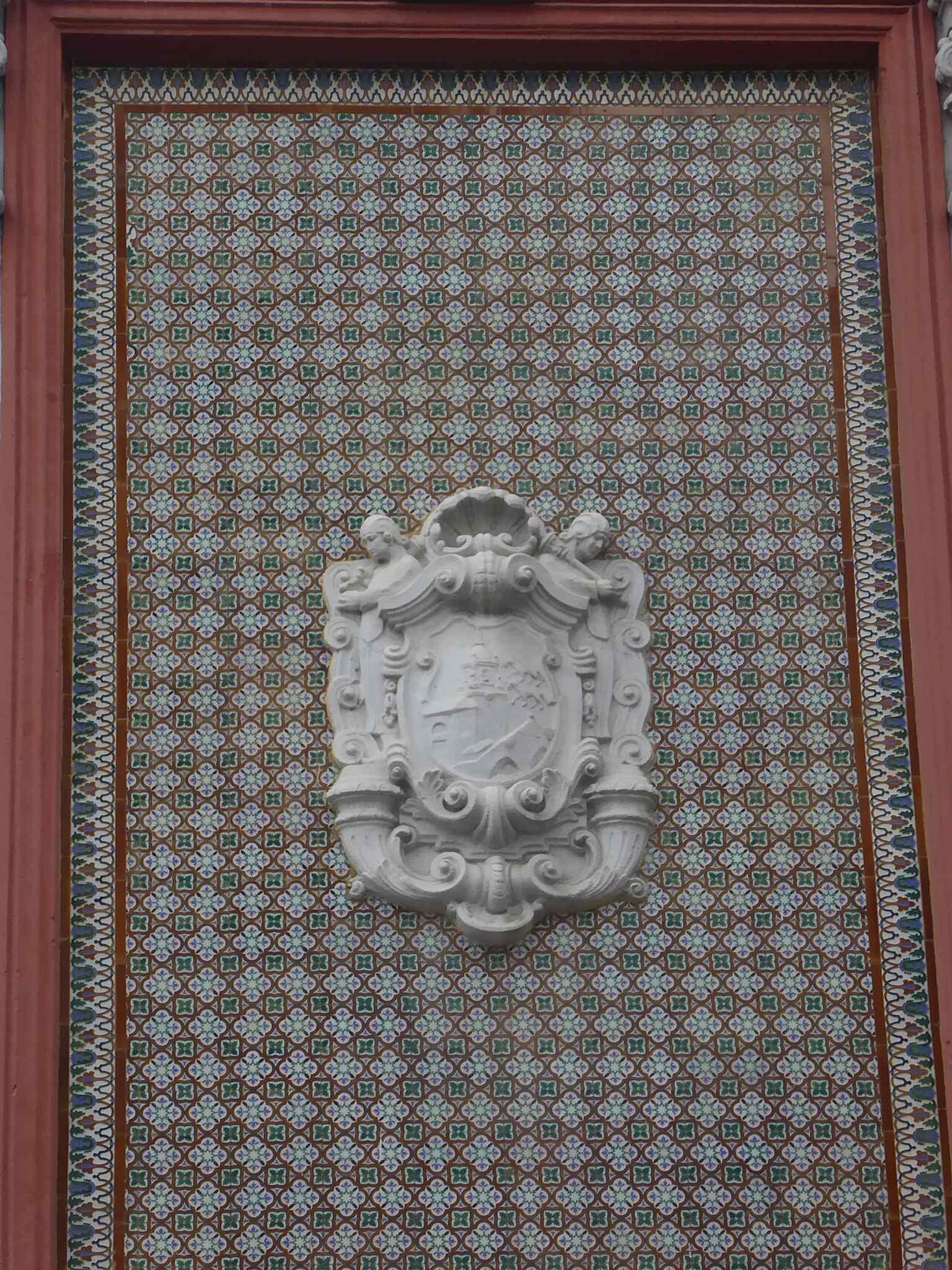 Decorative tilework on the market exterior, part of the rich façade treatment that distinguishes the building.