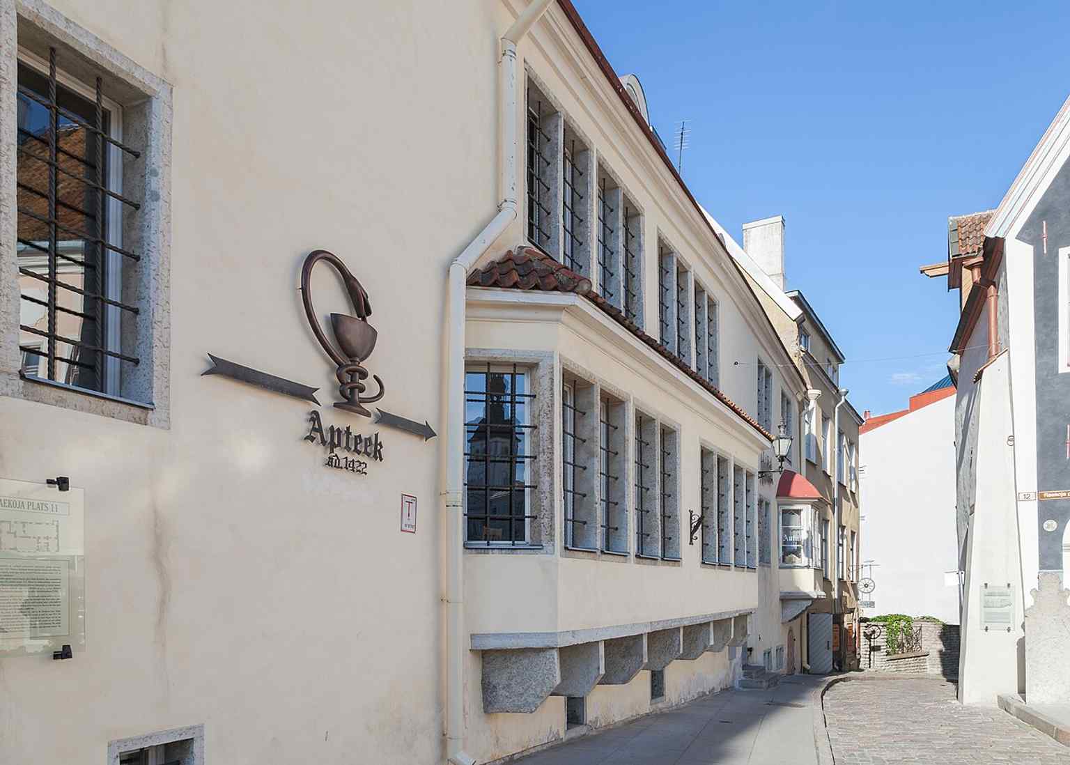 A wider street-level view of Town Hall Pharmacy, placing it directly opposite Tallinn’s city hall in the heart of the old town.