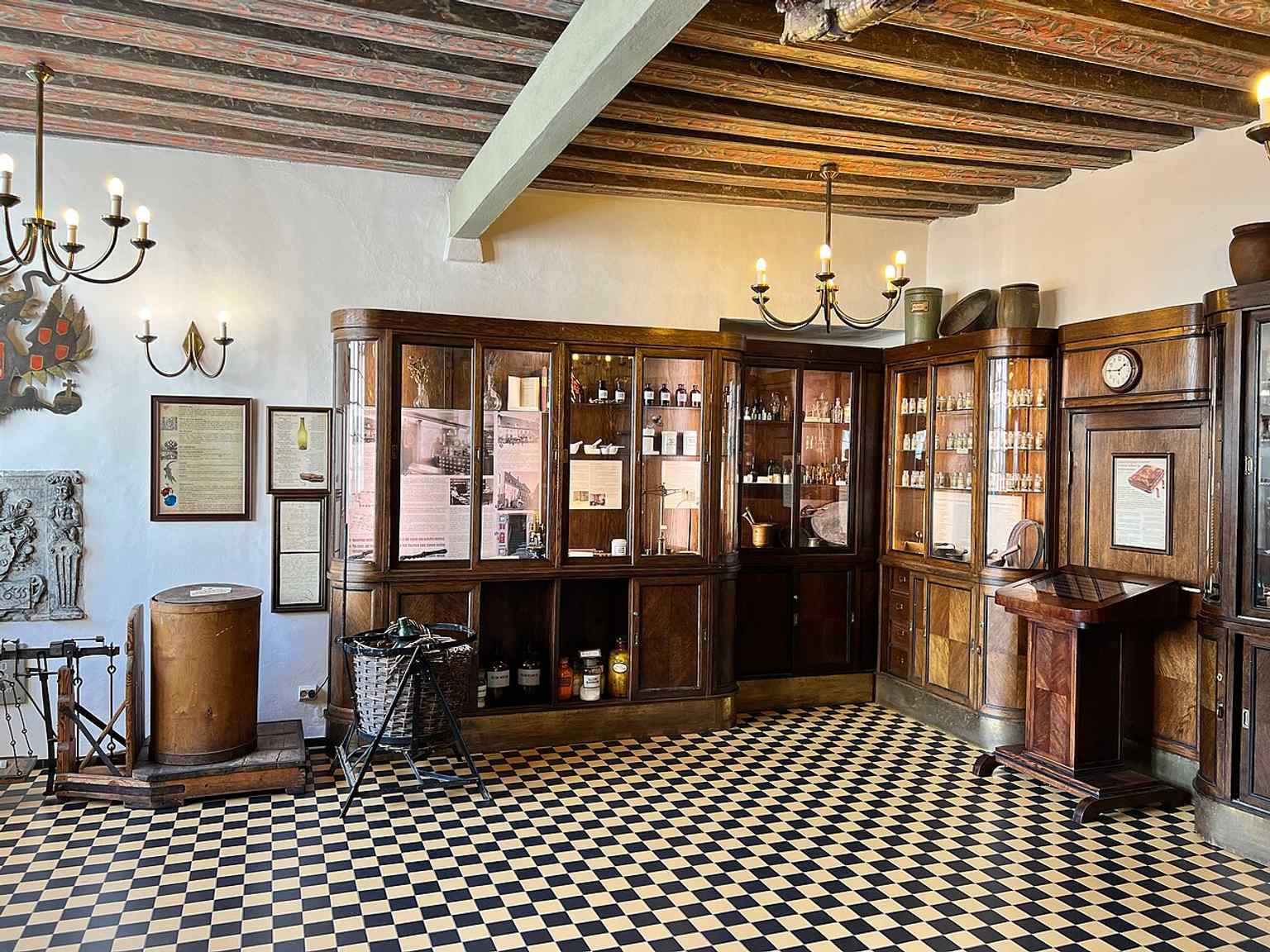 The interior of Raeapteek, where historic woodwork and displays help evoke its centuries as both apothecary and city meeting place.