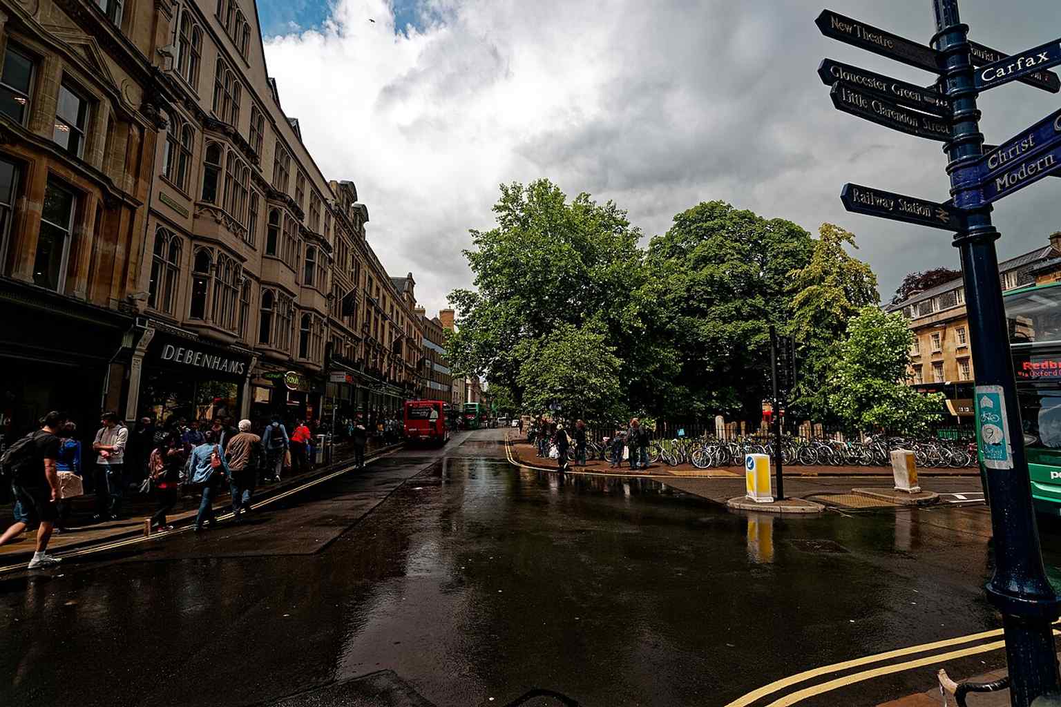 A clear view along Cornmarket Street, the north–south shopping street that links Magdalen Street with Carfax Tower.