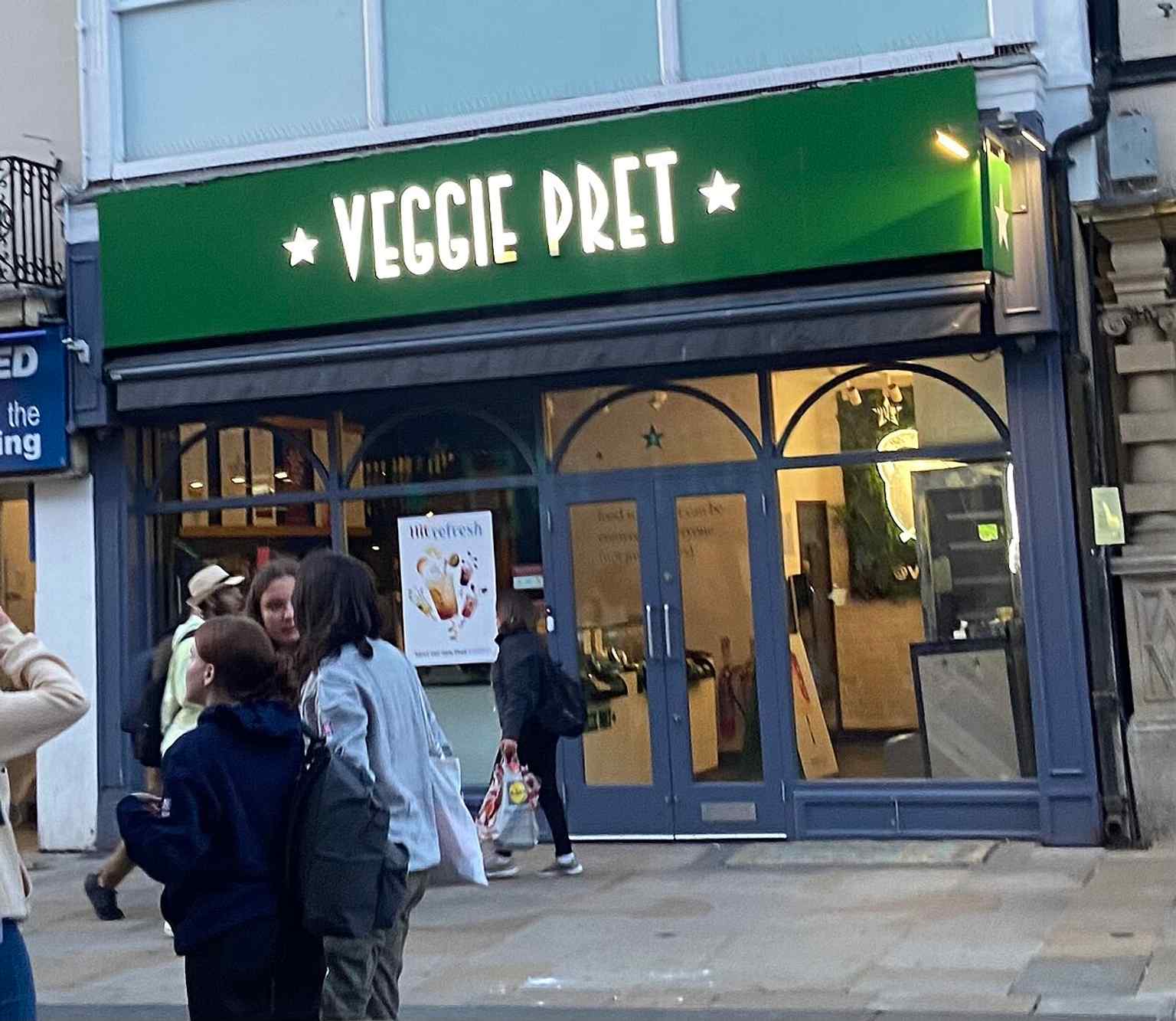 A modern shopfront on Cornmarket Street, showing the street’s continuing role as Oxford’s busy retail precinct.