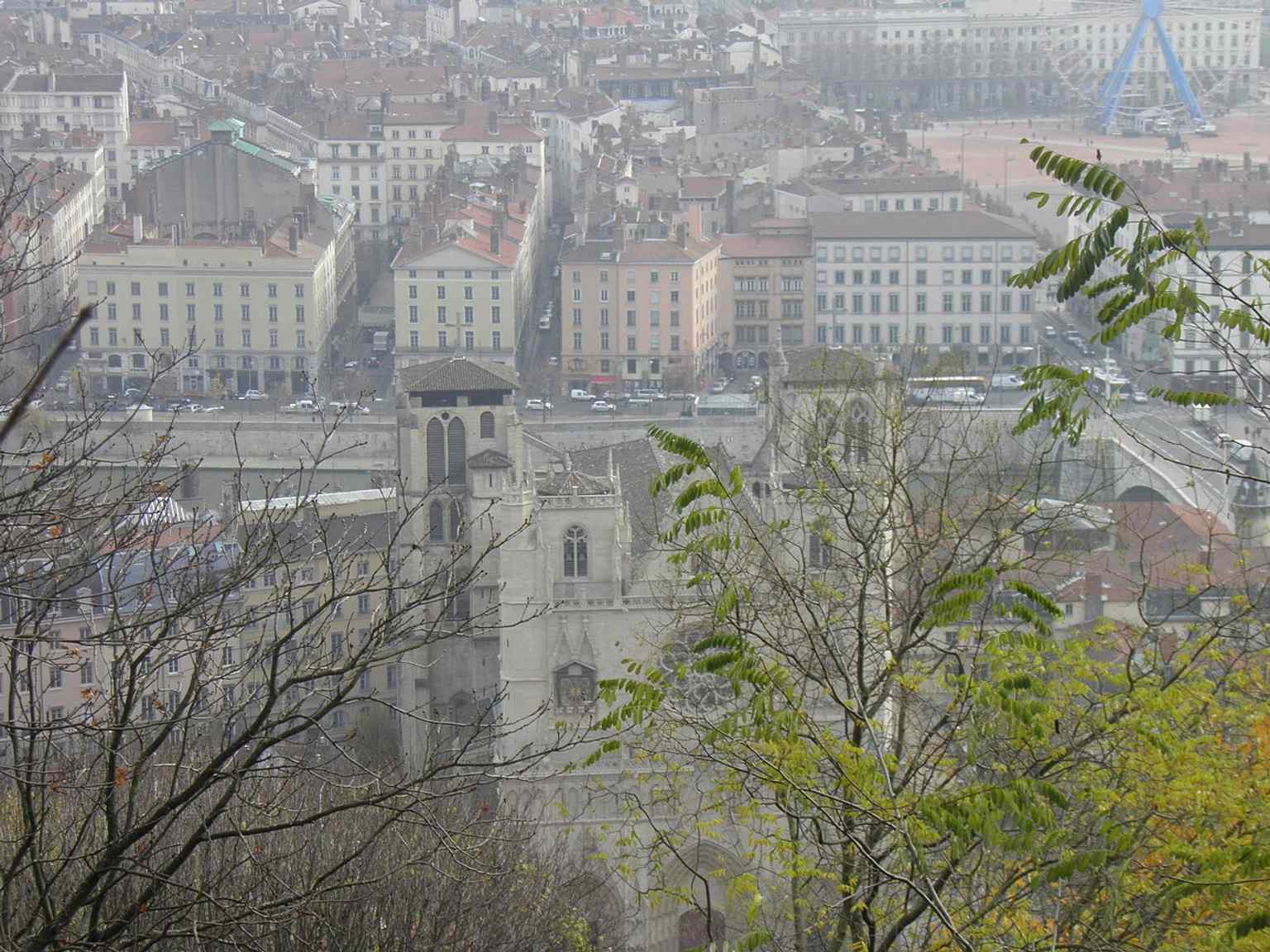 A sweeping elevated view of Saint John’s Cathedral over Old Lyon, showing how the church rises above the Saône-side quarter it has anchored for centuries.