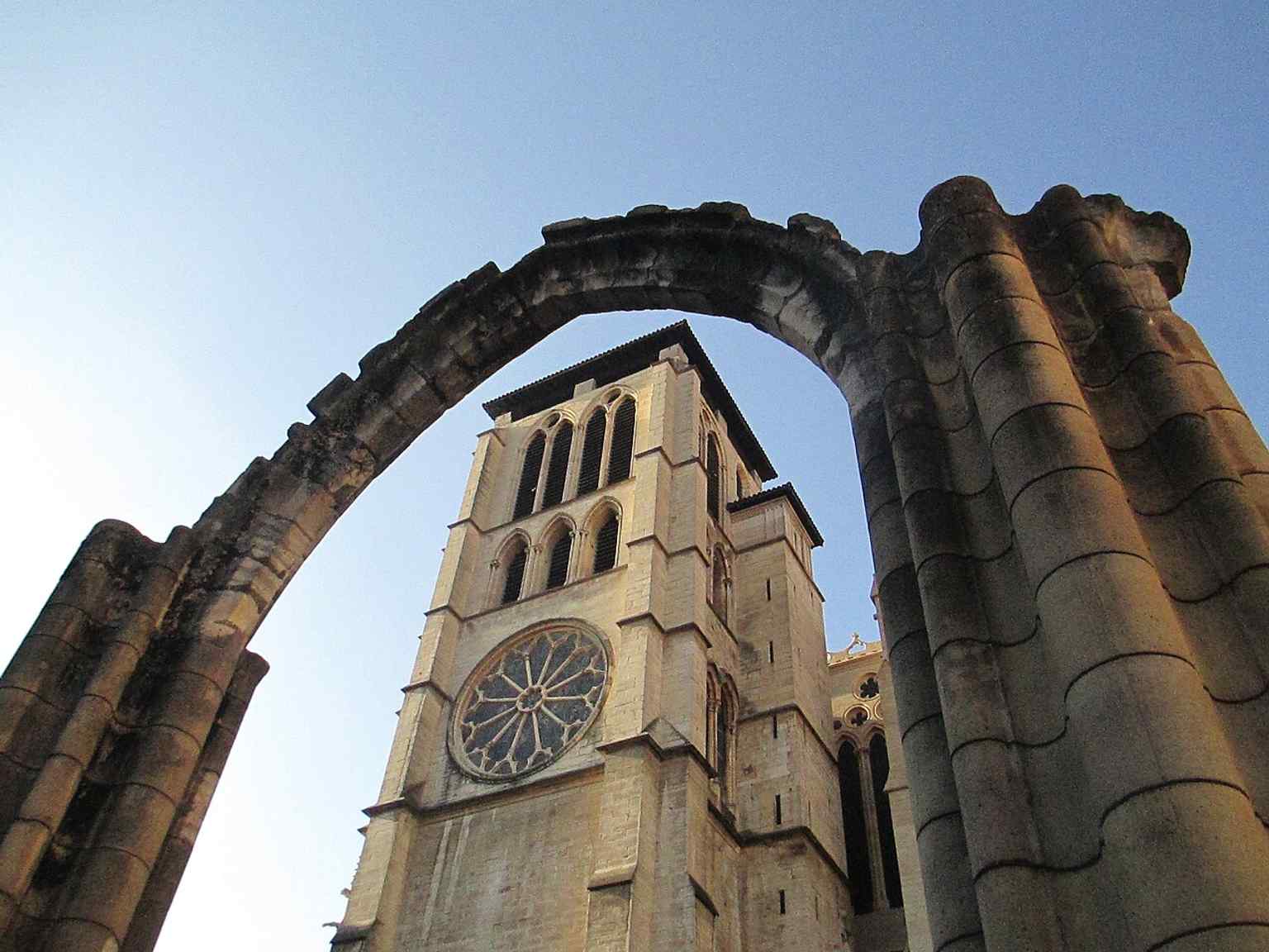 The northern tower seen through the ruins of Sainte-Croix, an evocative view of the vanished cathedral-group buildings that once surrounded Saint John’s.